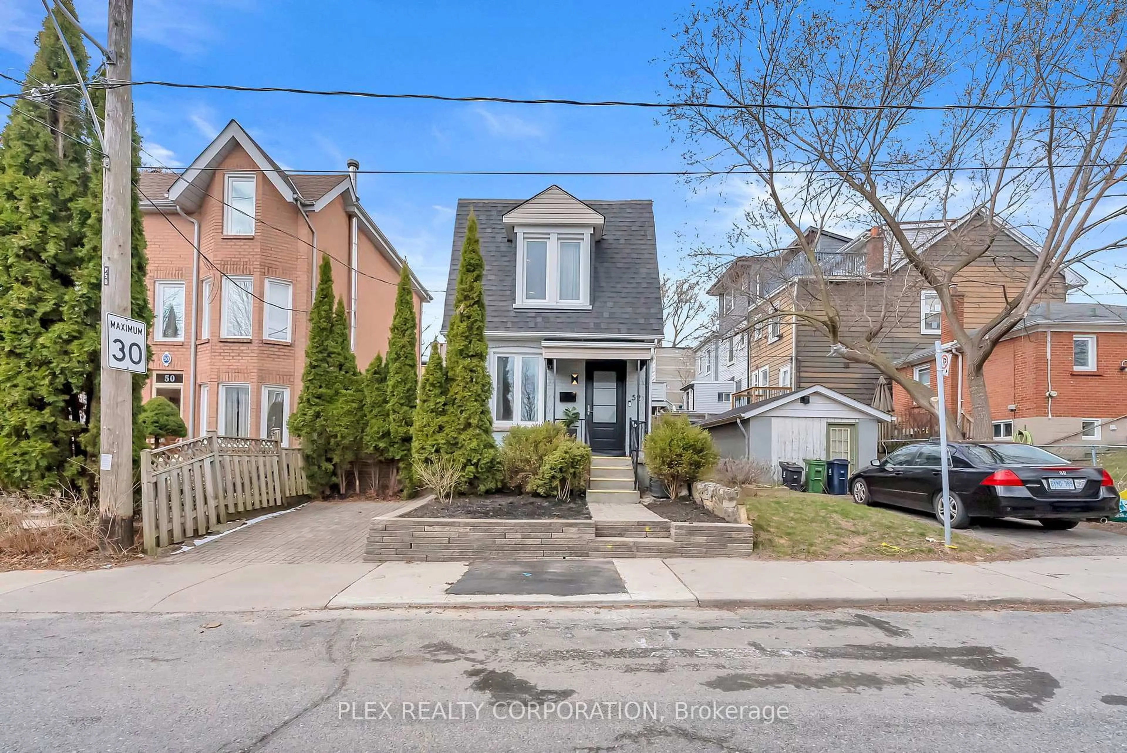 Home with brick exterior material, street for 52 Poucher St, Toronto Ontario M4J 2Y9