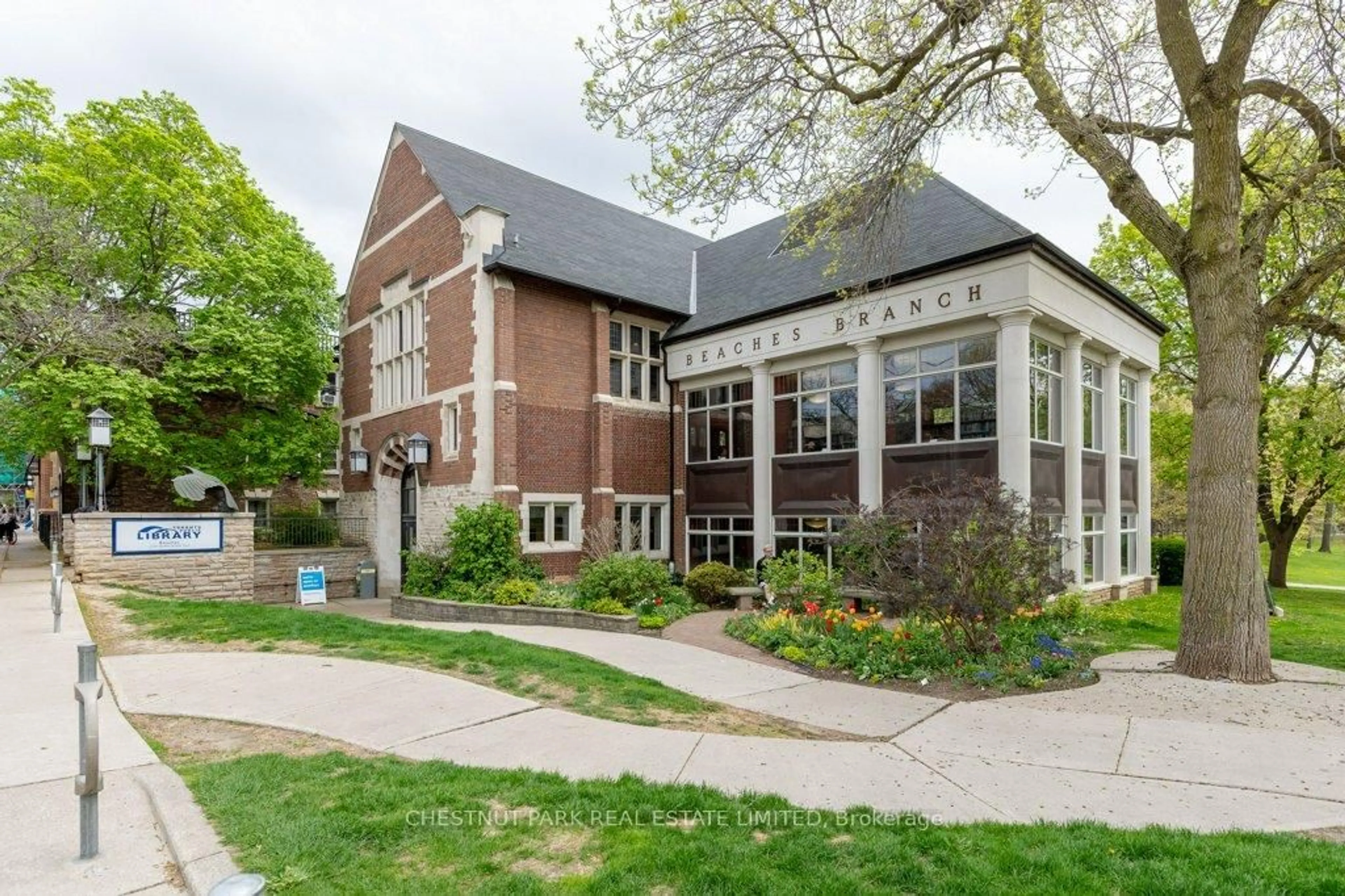 Home with brick exterior material, street for 2012 Queen St #201, Toronto Ontario M4L 1J3