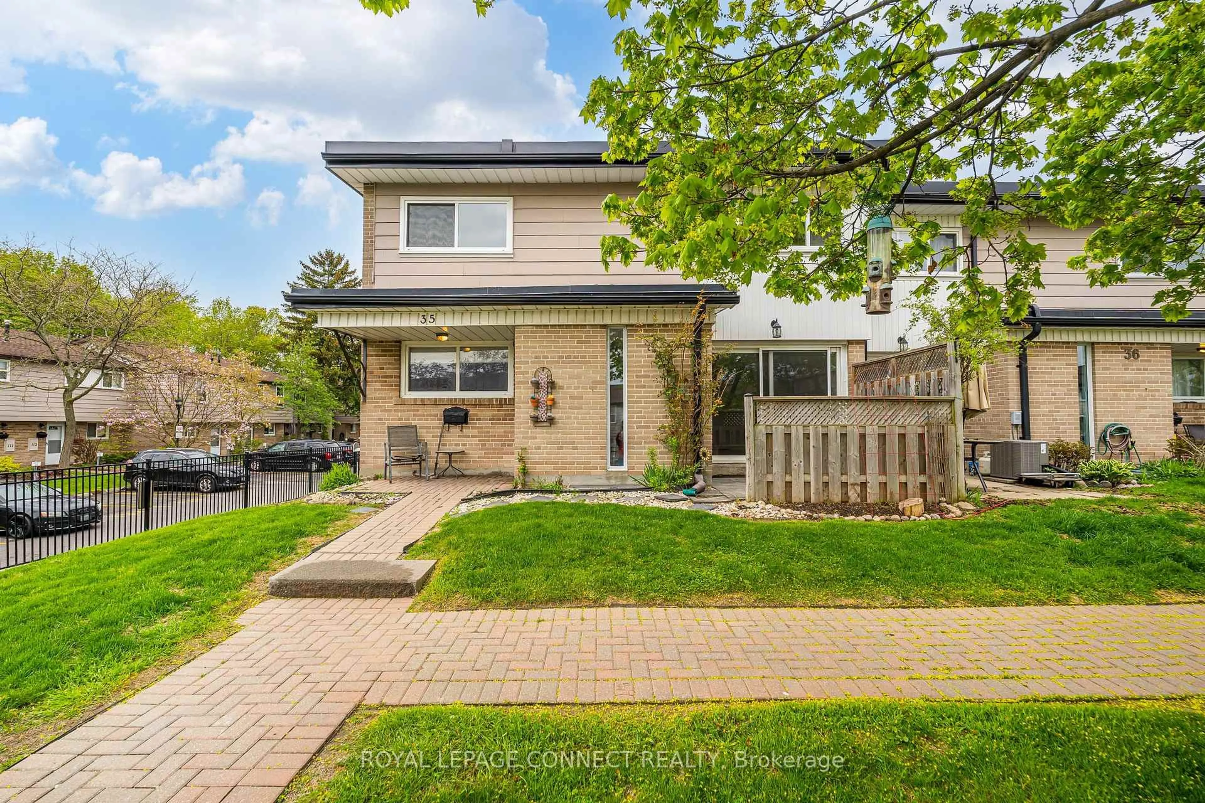 Home with brick exterior material, street for 925 Bayly St #35, Pickering Ontario L1W 1L4