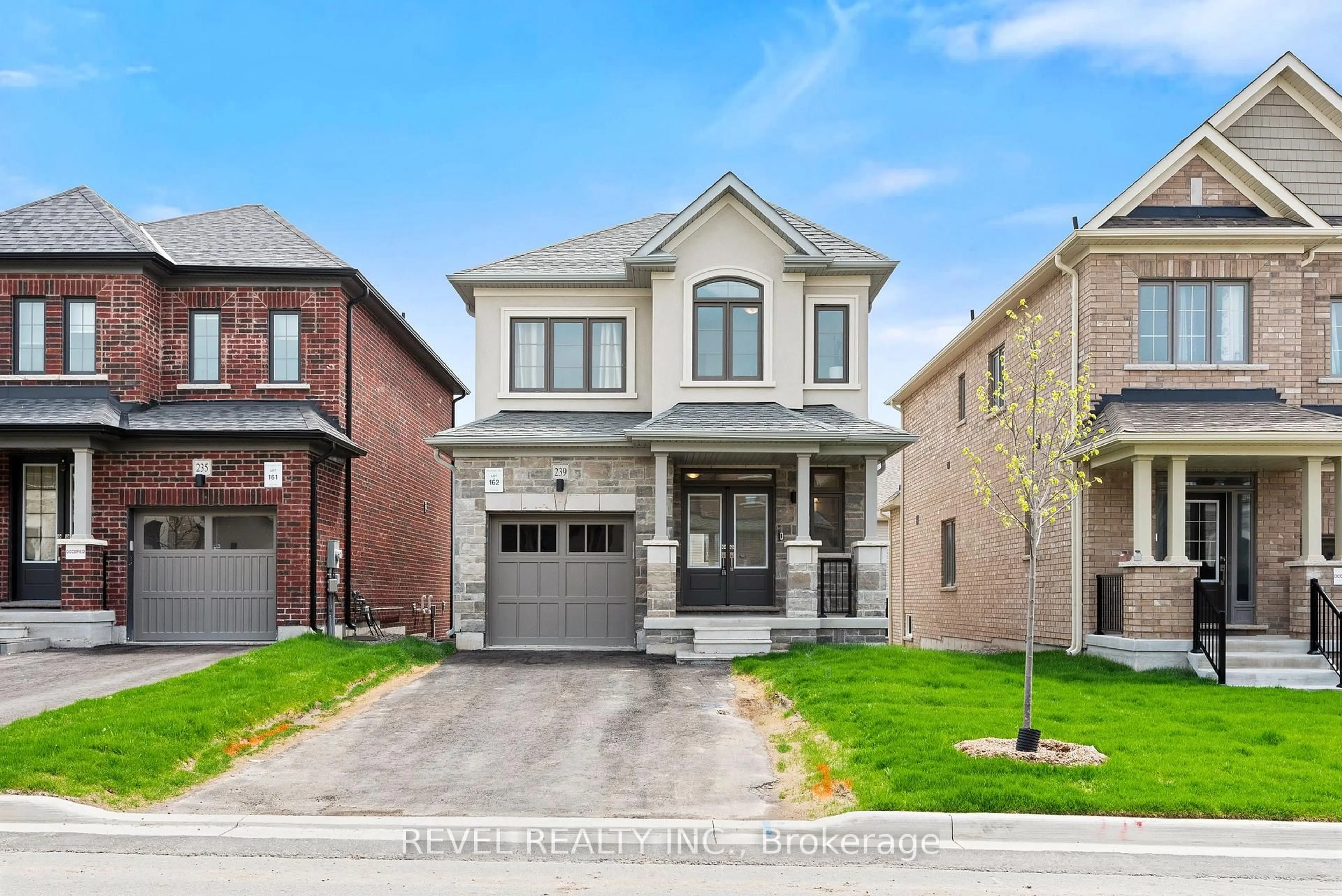 Home with brick exterior material, street for 239 Flood Ave, Clarington Ontario L1B 0W5