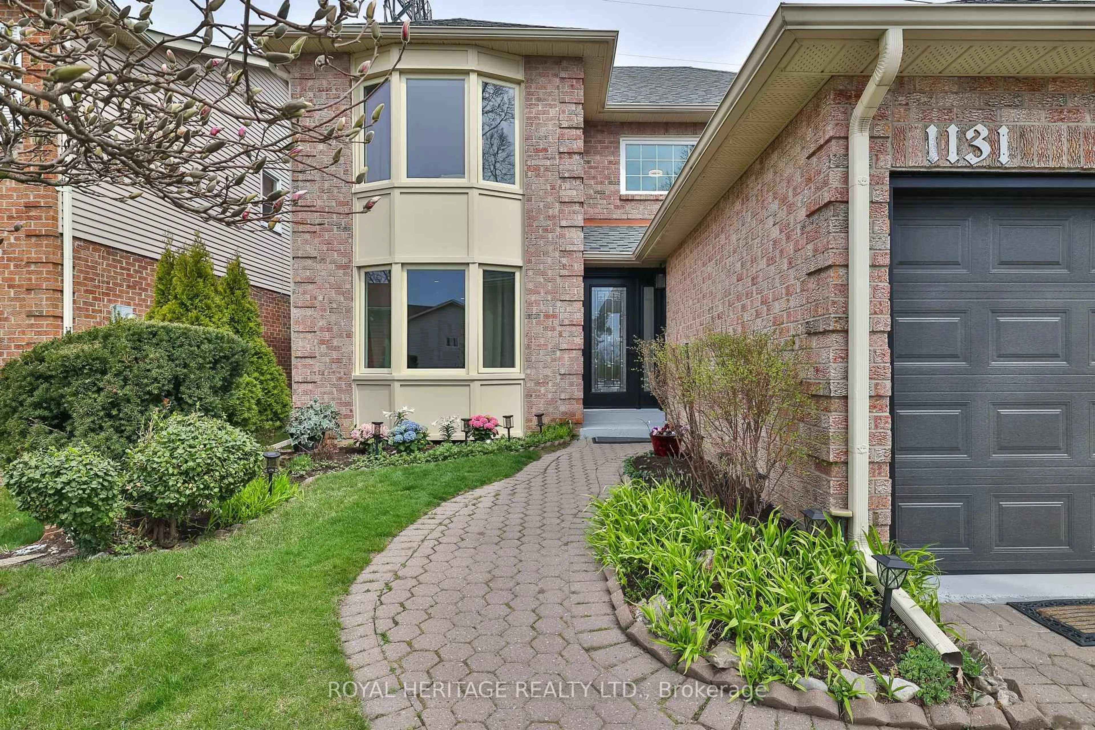 Home with brick exterior material, street for 1131 Harvest Dr, Pickering Ontario L1X 1B5