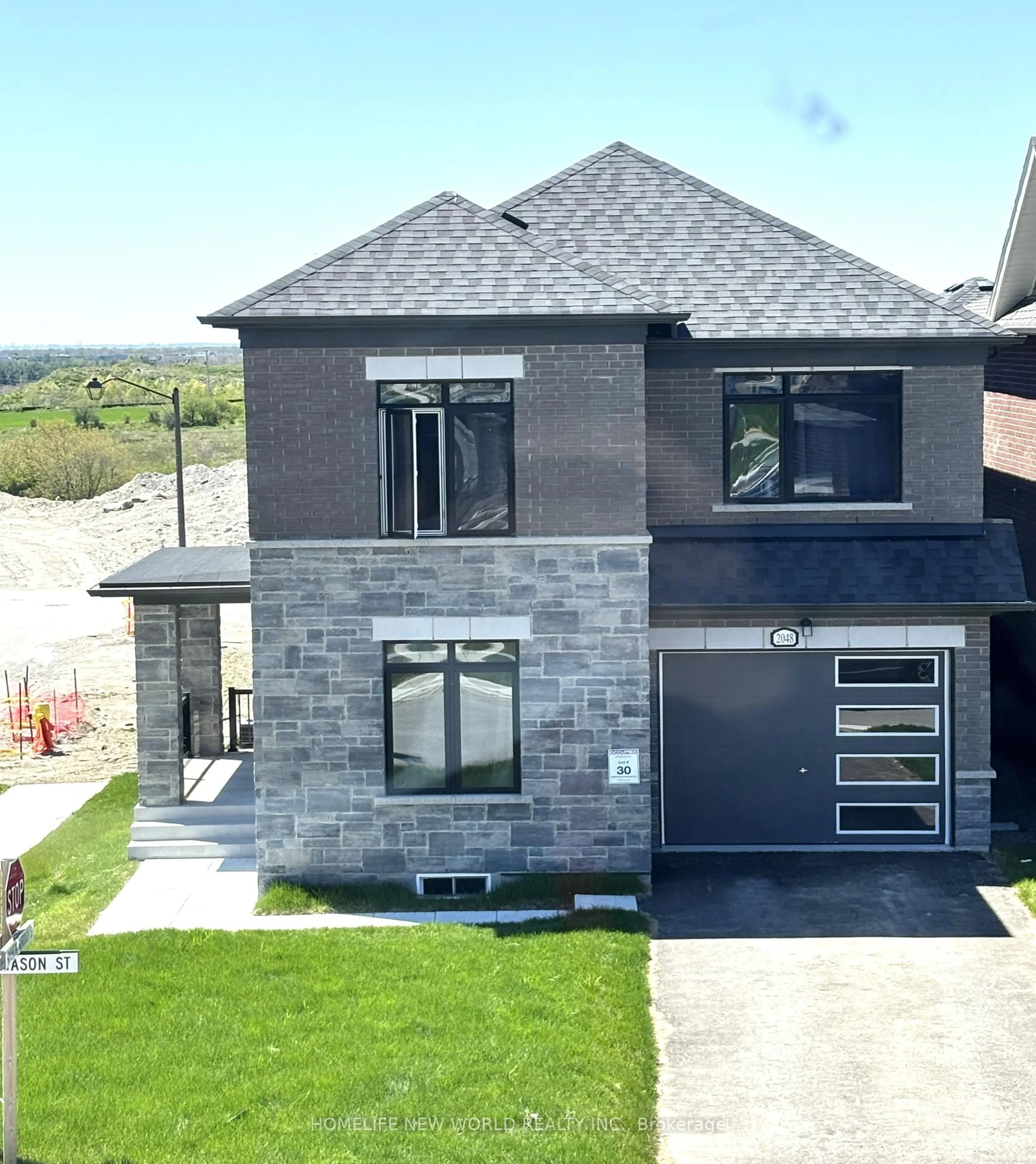 Home with brick exterior material, street for 2048 Chris Mason St, Oshawa Ontario L1L 0S5
