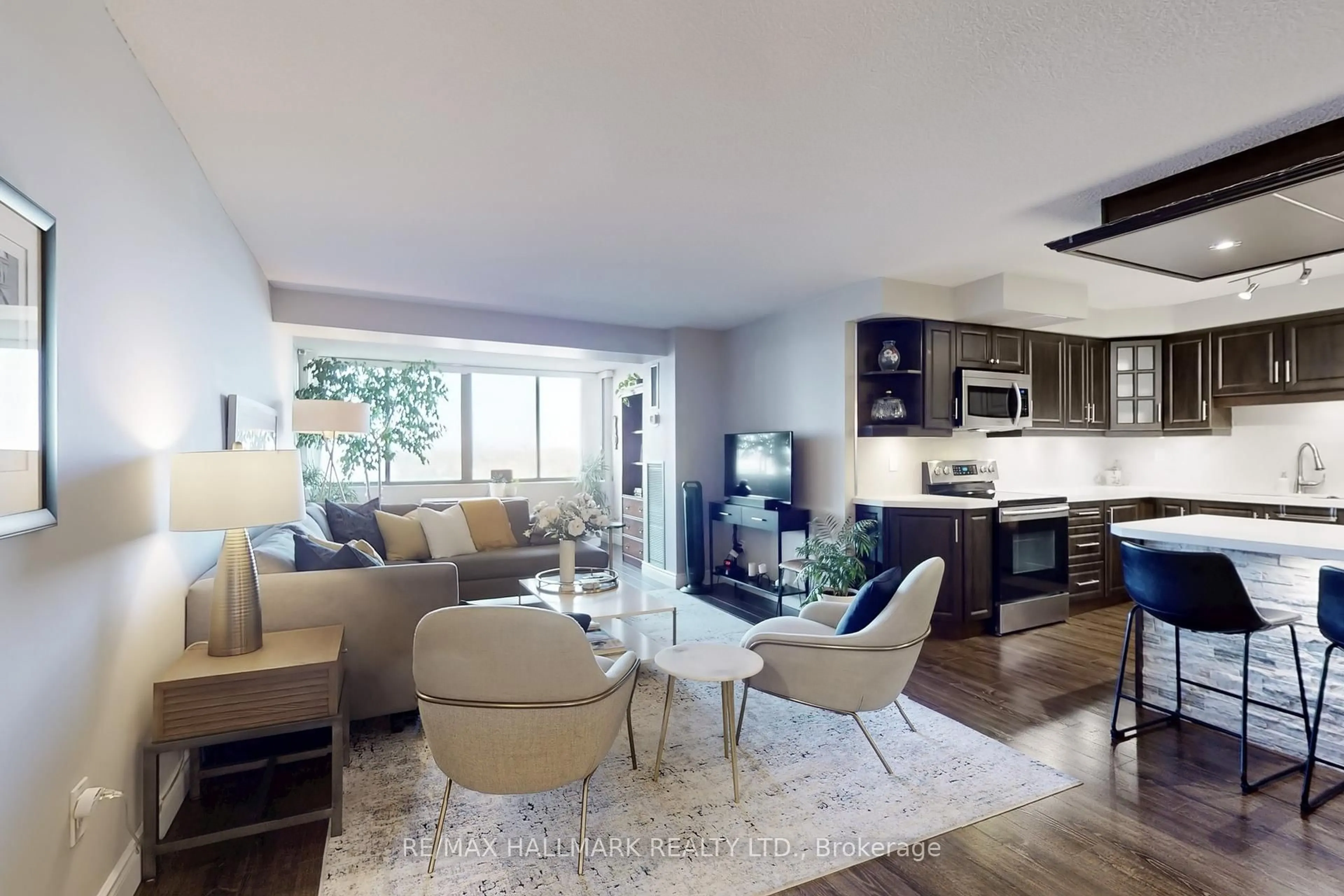Living room with furniture, wood/laminate floor for 2350 Bridletowne Circ #1102, Toronto Ontario M1W 3E6