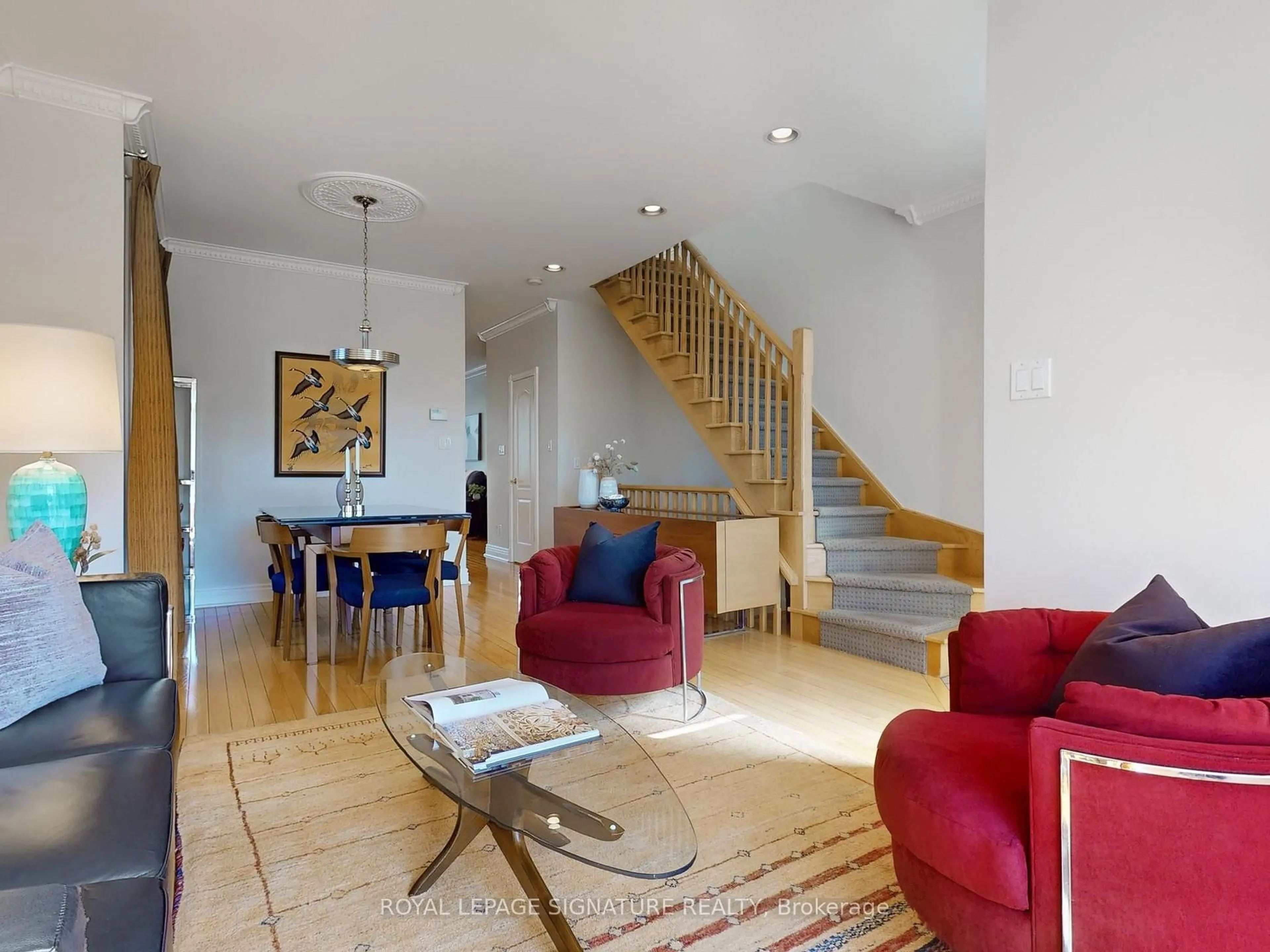Living room with furniture, wood/laminate floor for 53 Stanhope Ave, Toronto Ontario M4K 3N4