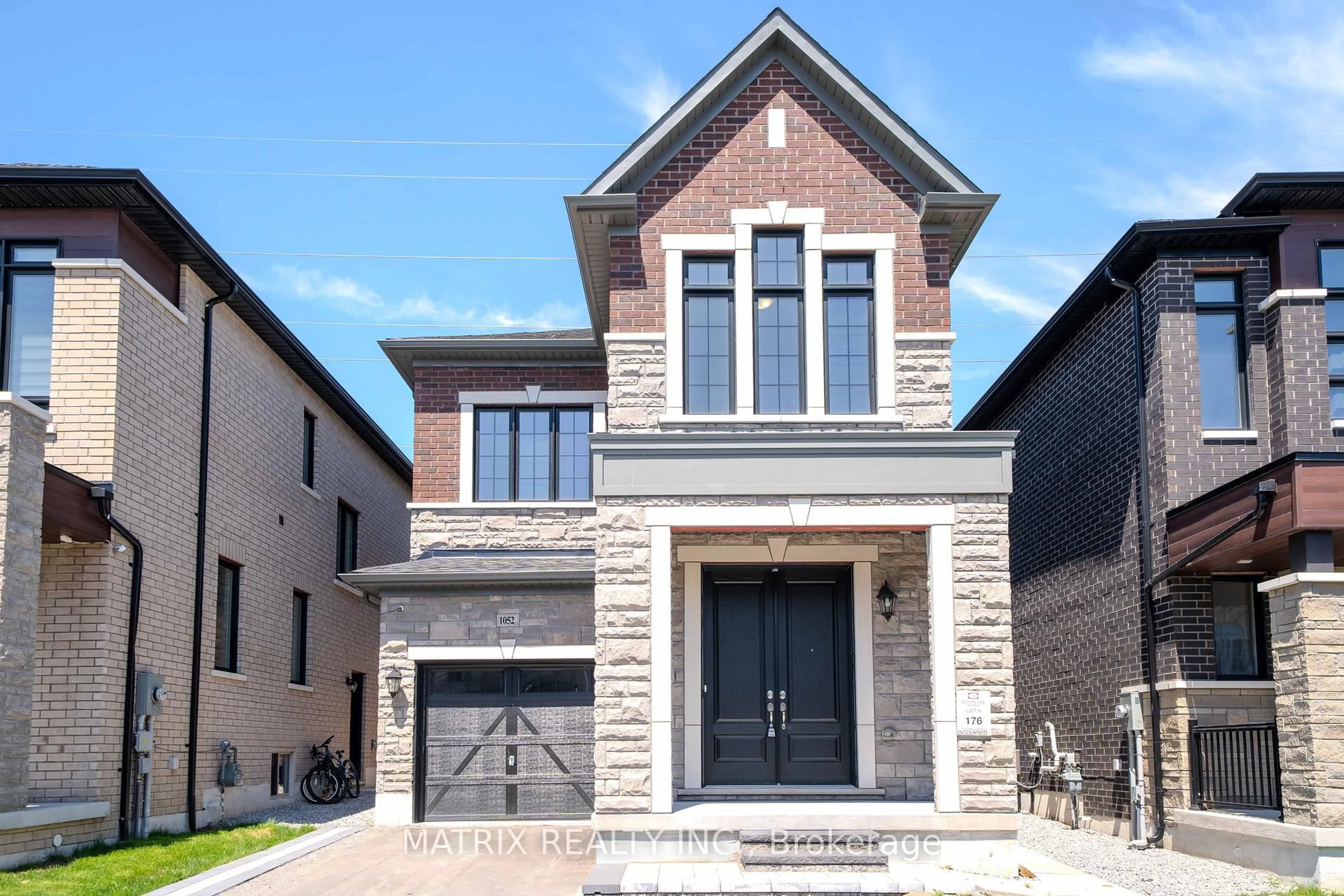 Home with brick exterior material, street for 1052 Skyridge Blvd, Pickering Ontario L1X 0G5