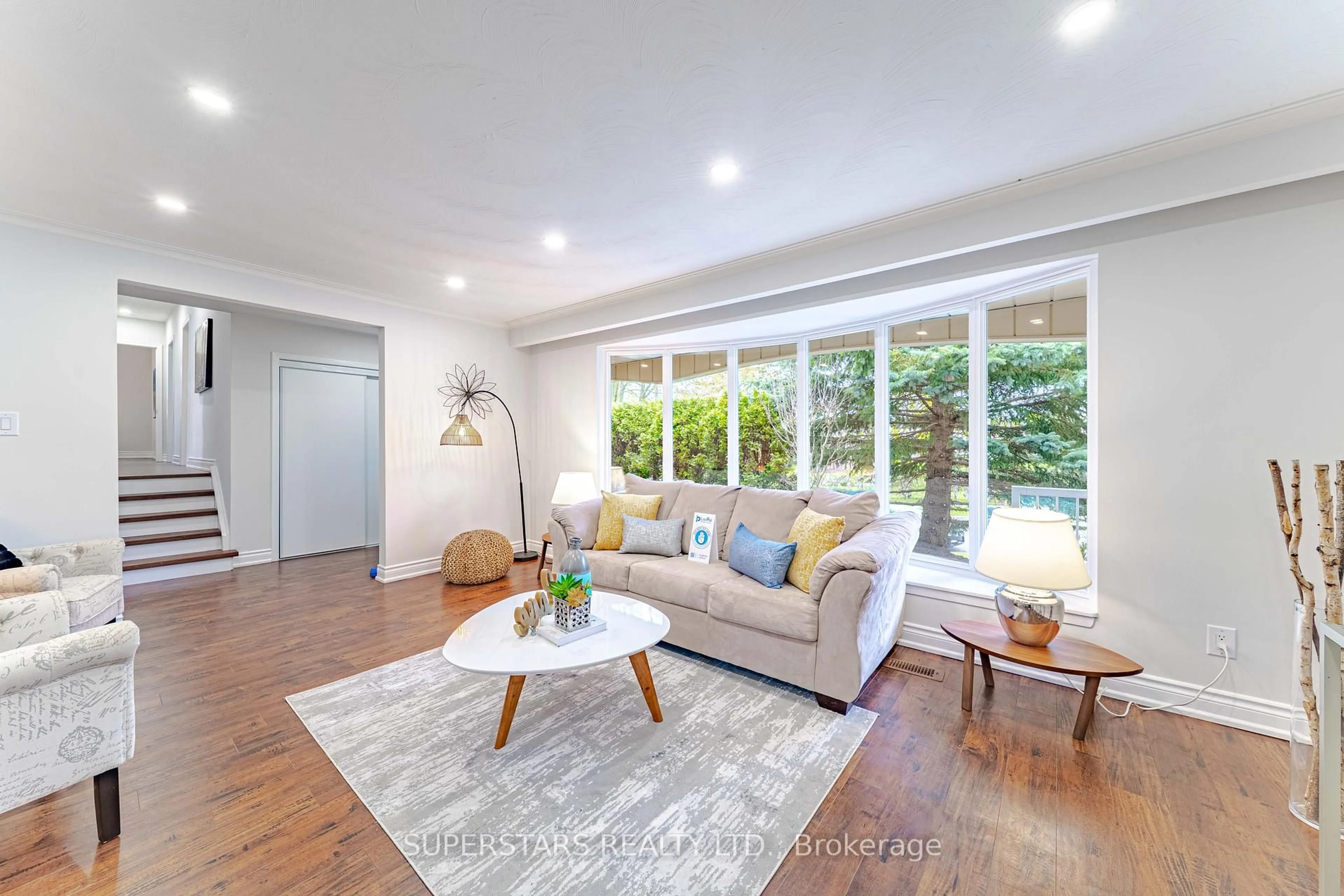 Living room with furniture, wood/laminate floor for 1 Mayhill Cres, Toronto Ontario M1G 1K5
