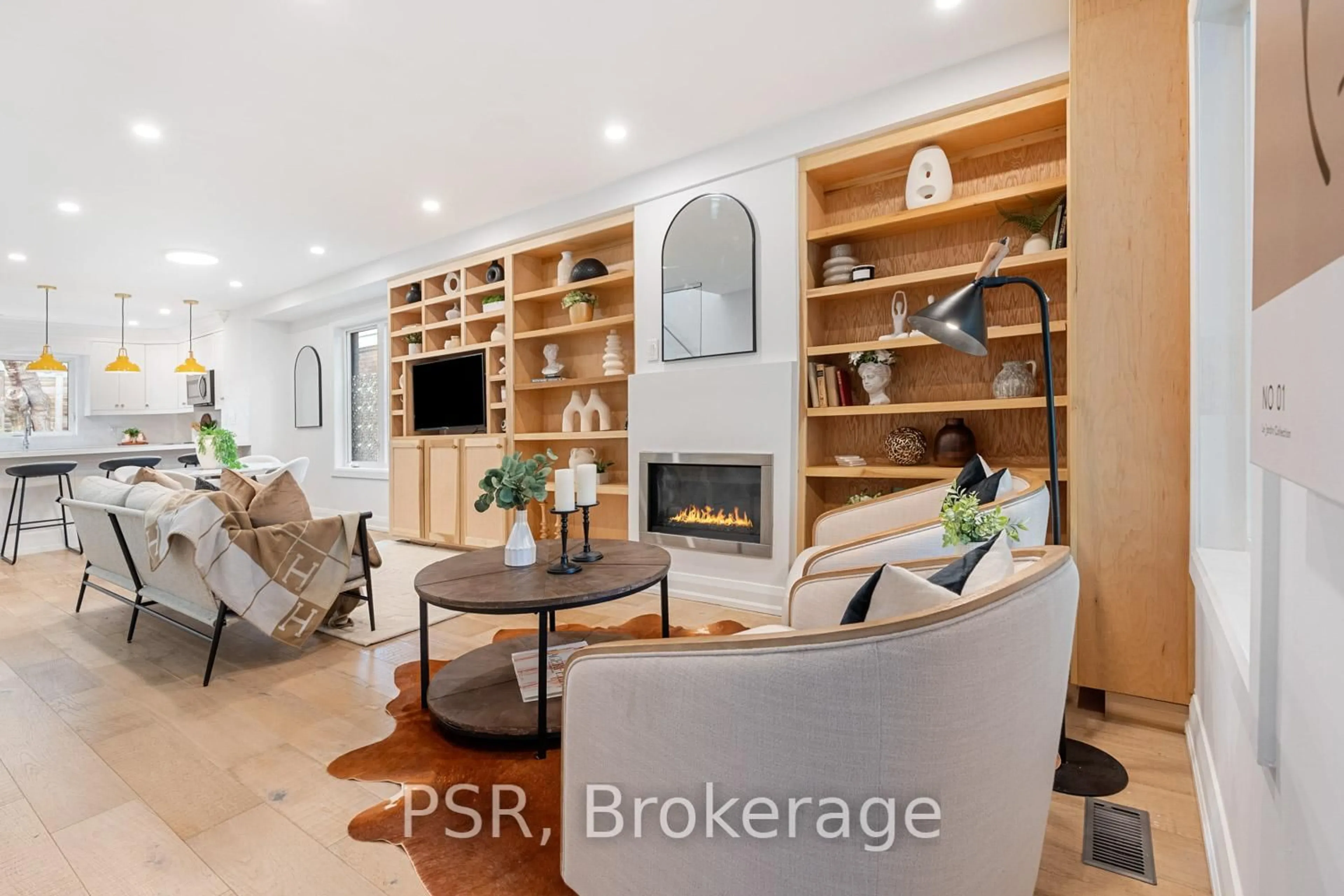 Living room with furniture, wood/laminate floor for 43 Hemlock Ave, Toronto Ontario M4L 3E9