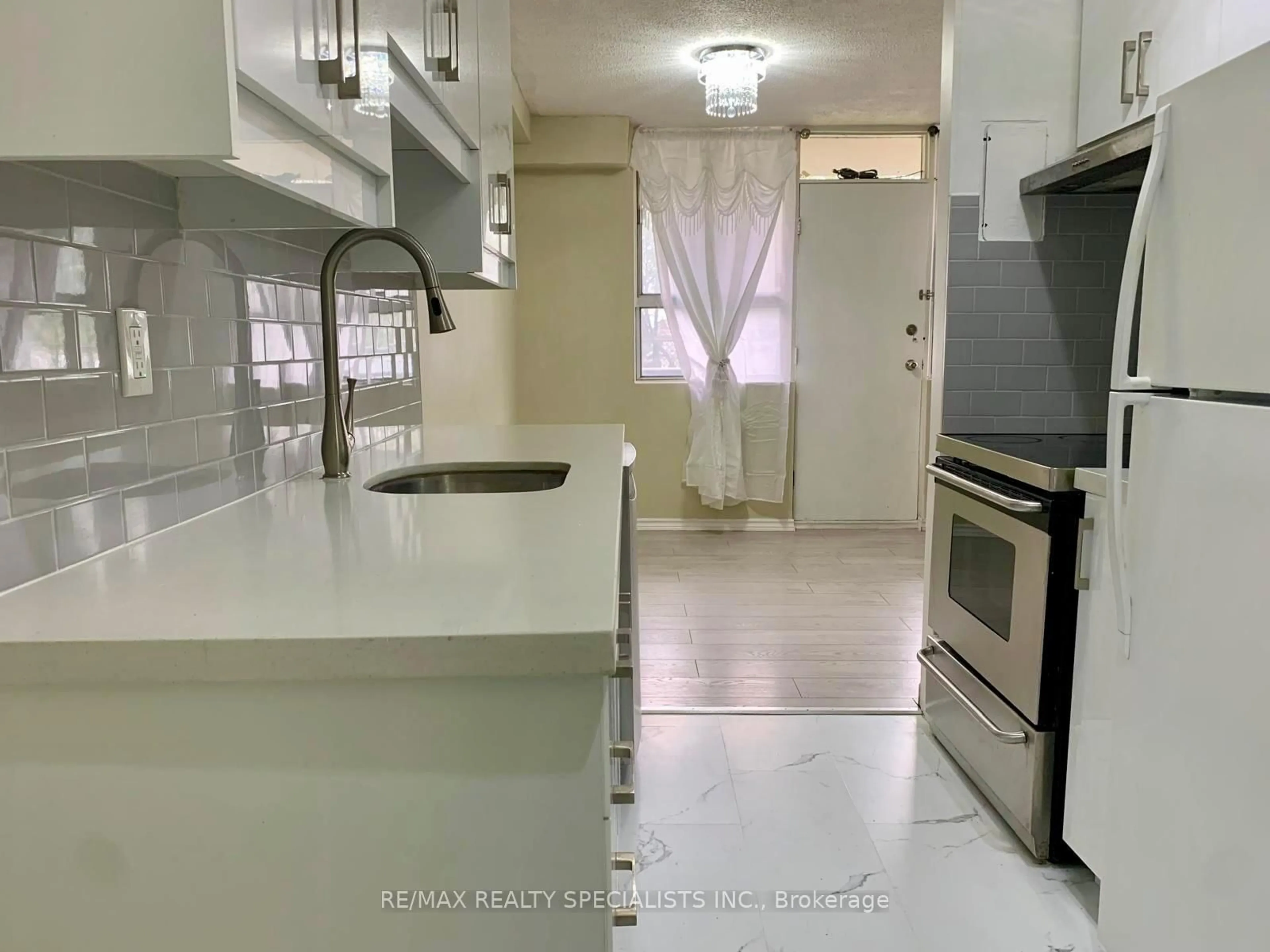 Standard kitchen, ceramic/tile floor for 1950 Kennedy Rd #108, Toronto Ontario M1P 4S9