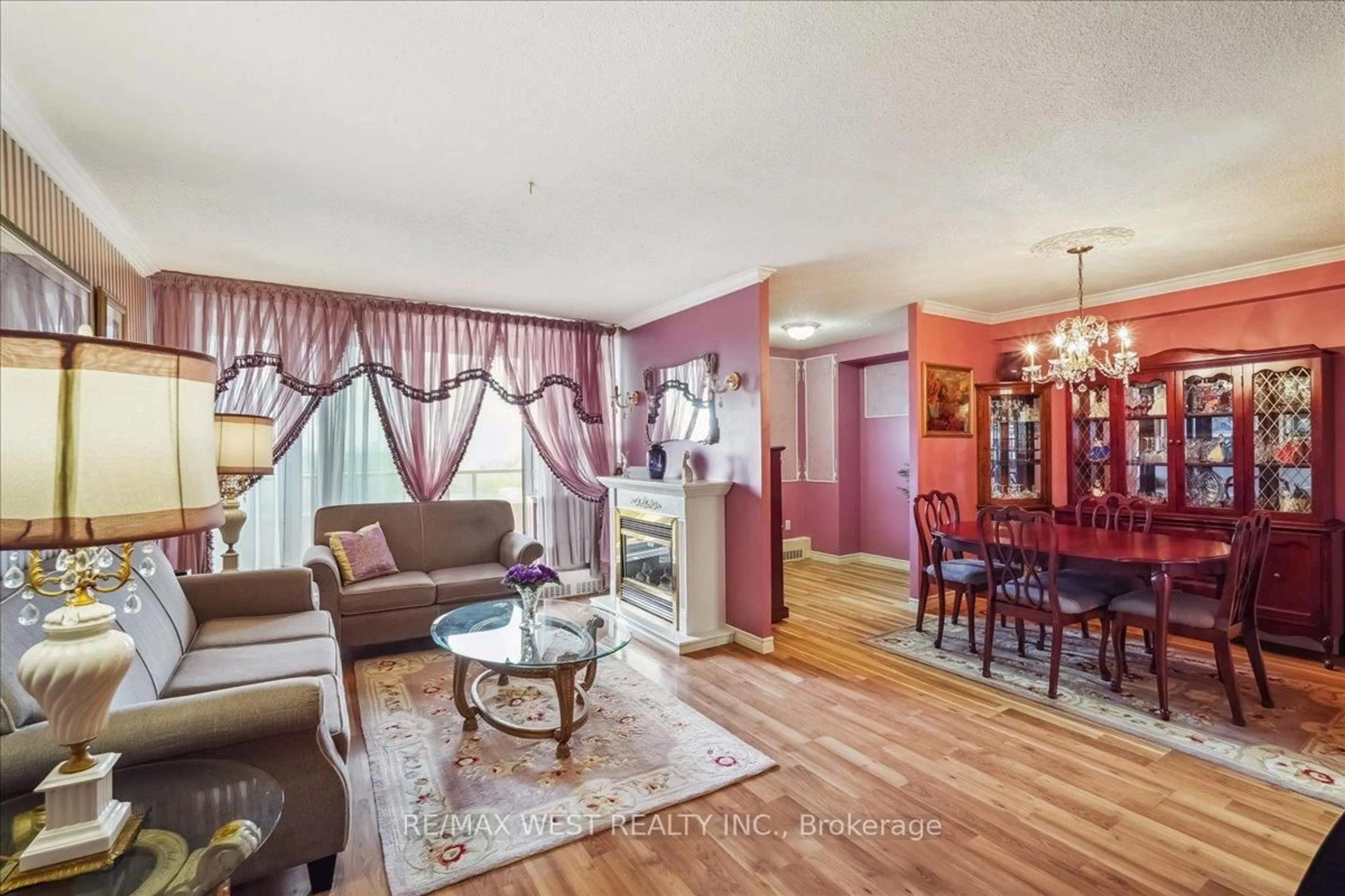 Living room with furniture, wood/laminate floor for 15 Torrance Rd #1002, Toronto Ontario M1J 3K2