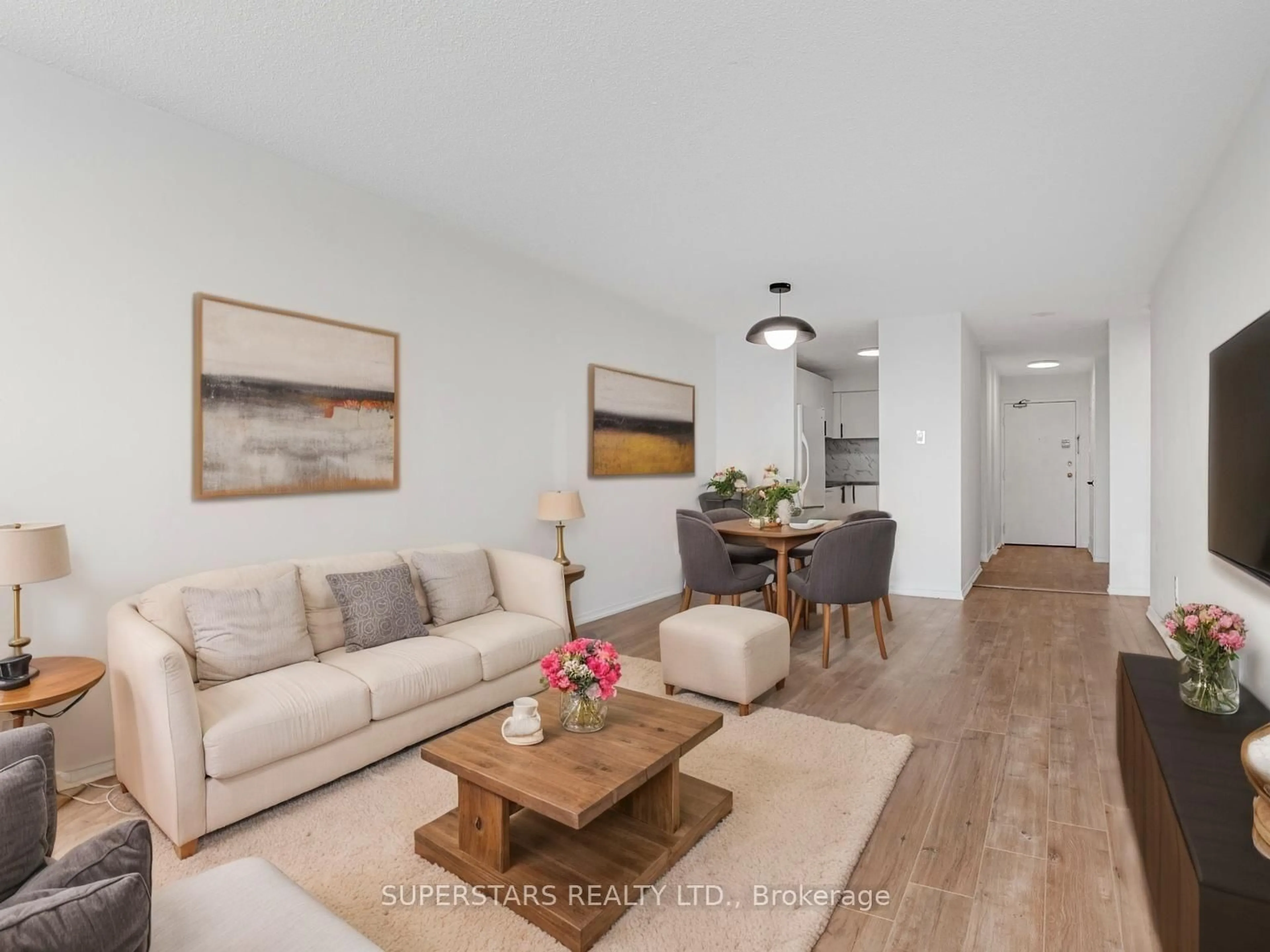 Living room with furniture, wood/laminate floor for 99 Blackwell Ave #813, Toronto Ontario M1B 3R5