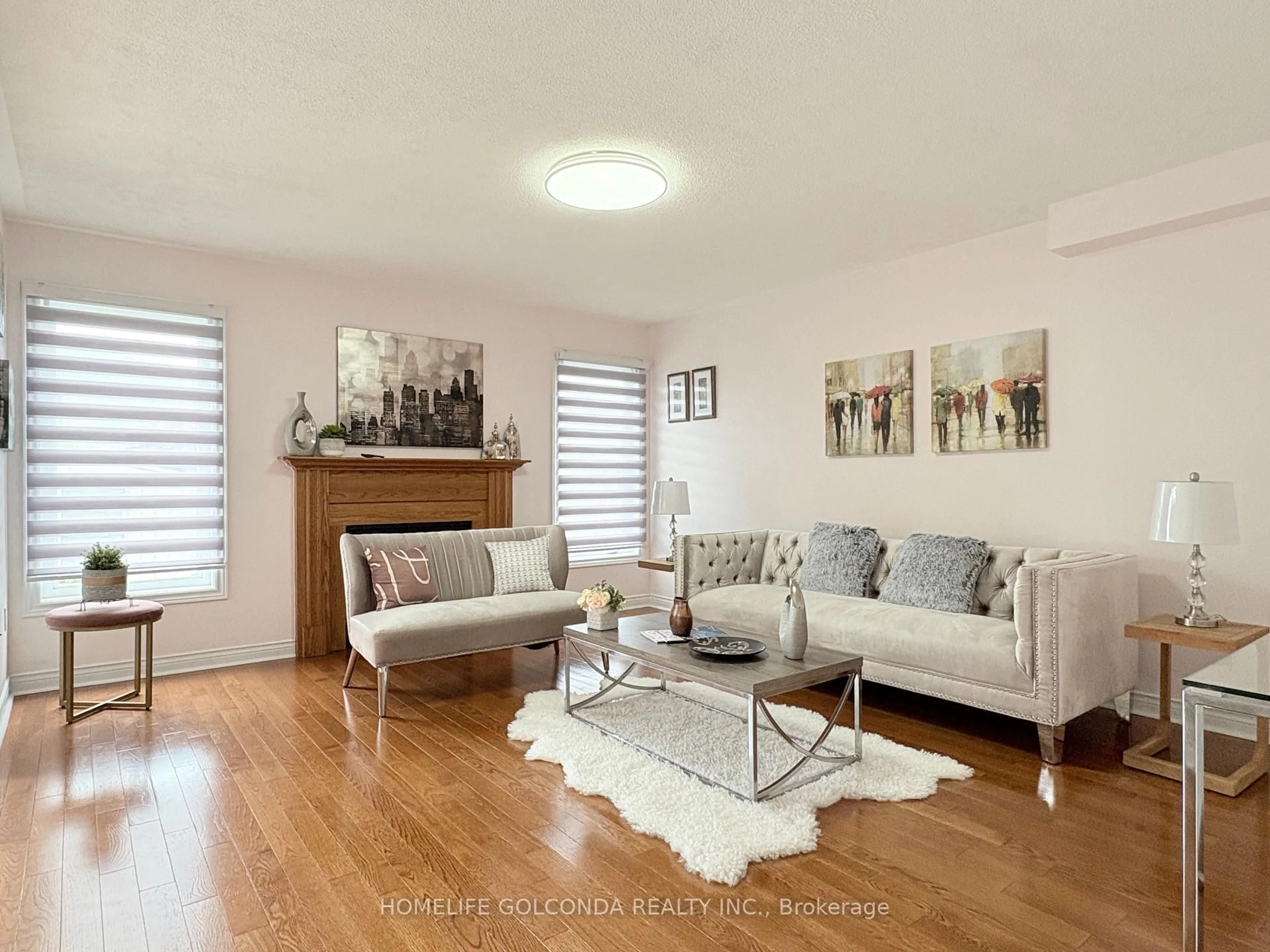 Living room with furniture, wood/laminate floor for 56 Lurosa Cres, Whitby Ontario L1R 3A9