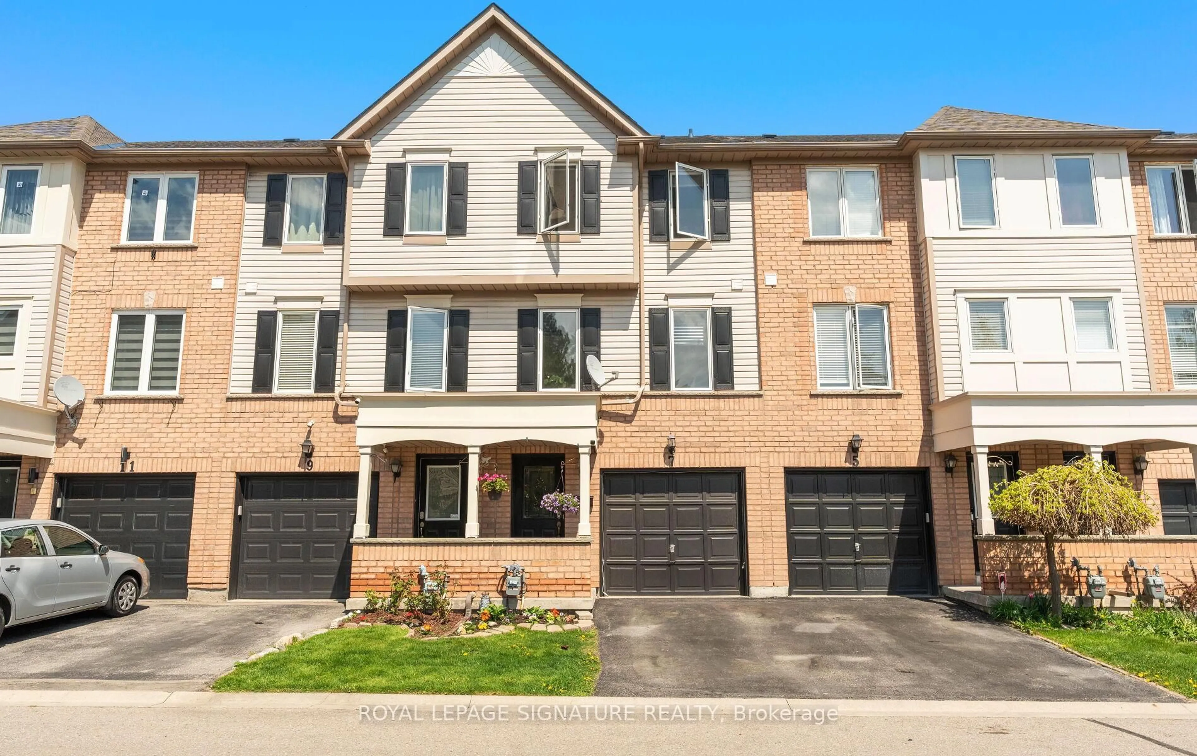 Home with brick exterior material, street for 7 Pennefather Lane, Ajax Ontario L1T 4H2