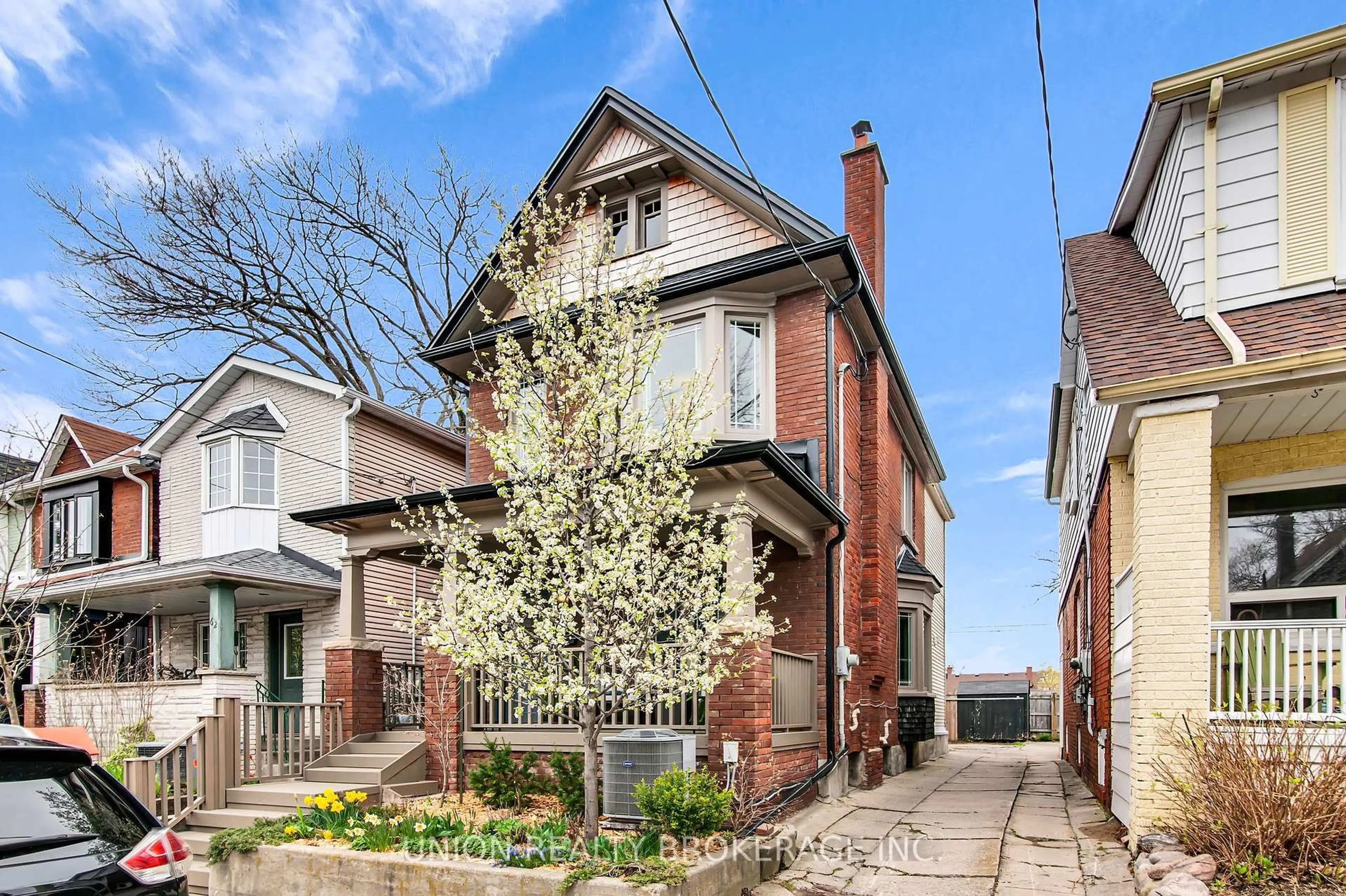 Home with brick exterior material, street for 64 Amroth Ave, Toronto Ontario M4C 4H2