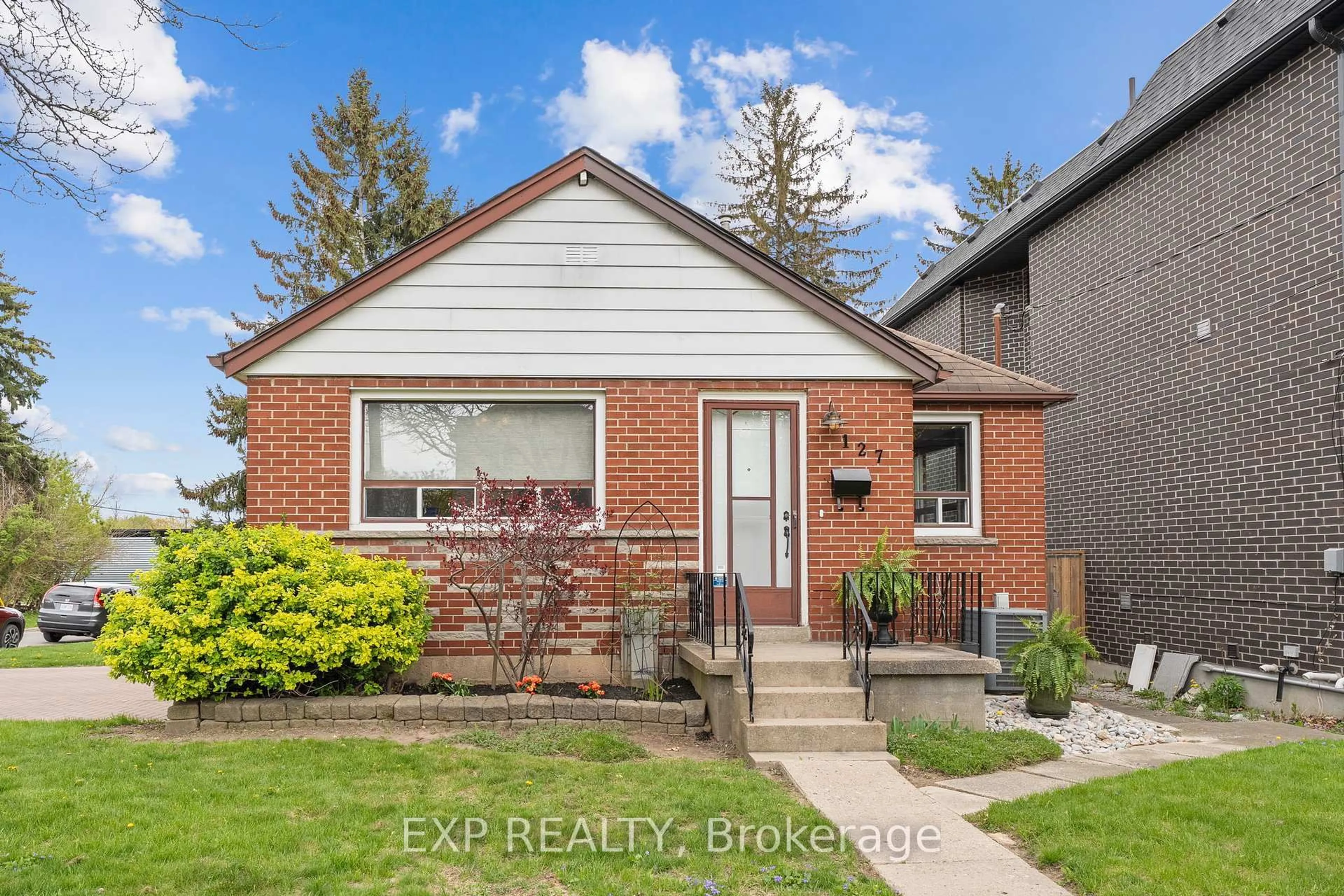 Home with brick exterior material, street for 127 Donside Dr, Toronto Ontario M1L 1P9