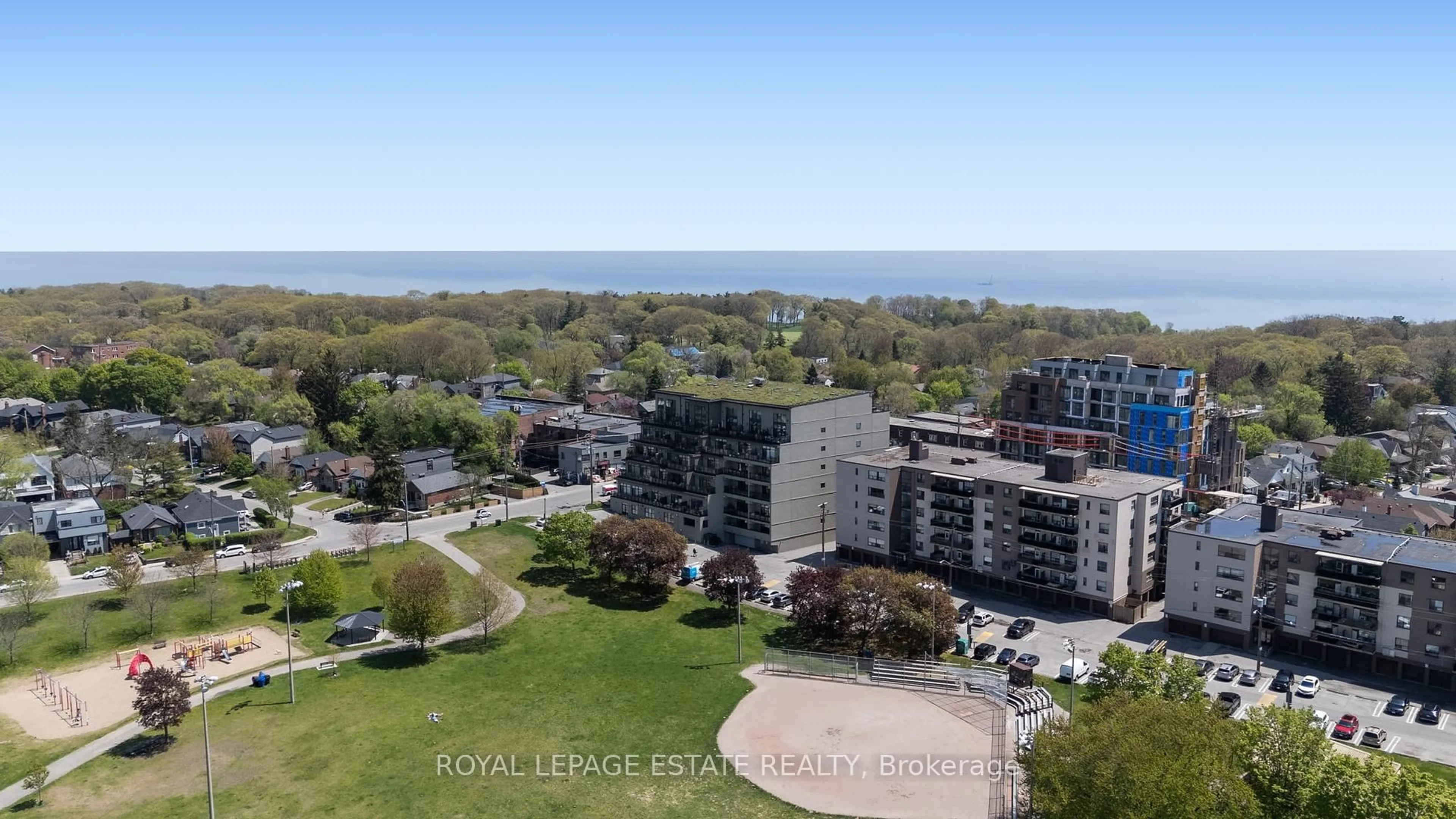 A pic from outside/outdoor area/front of a property/back of a property/a pic from drone, water/lake/river/ocean view for 160 Fallingbrook Rd #409, Toronto Ontario M1N 0A1