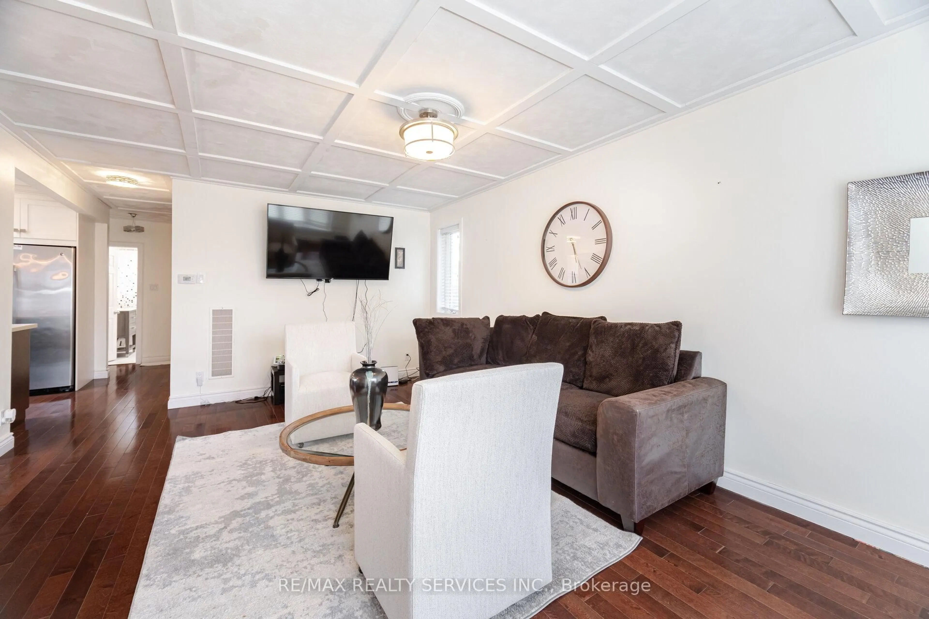 Living room with furniture, wood/laminate floor for 204 Craydon Rd, Whitby Ontario L1N 2B6