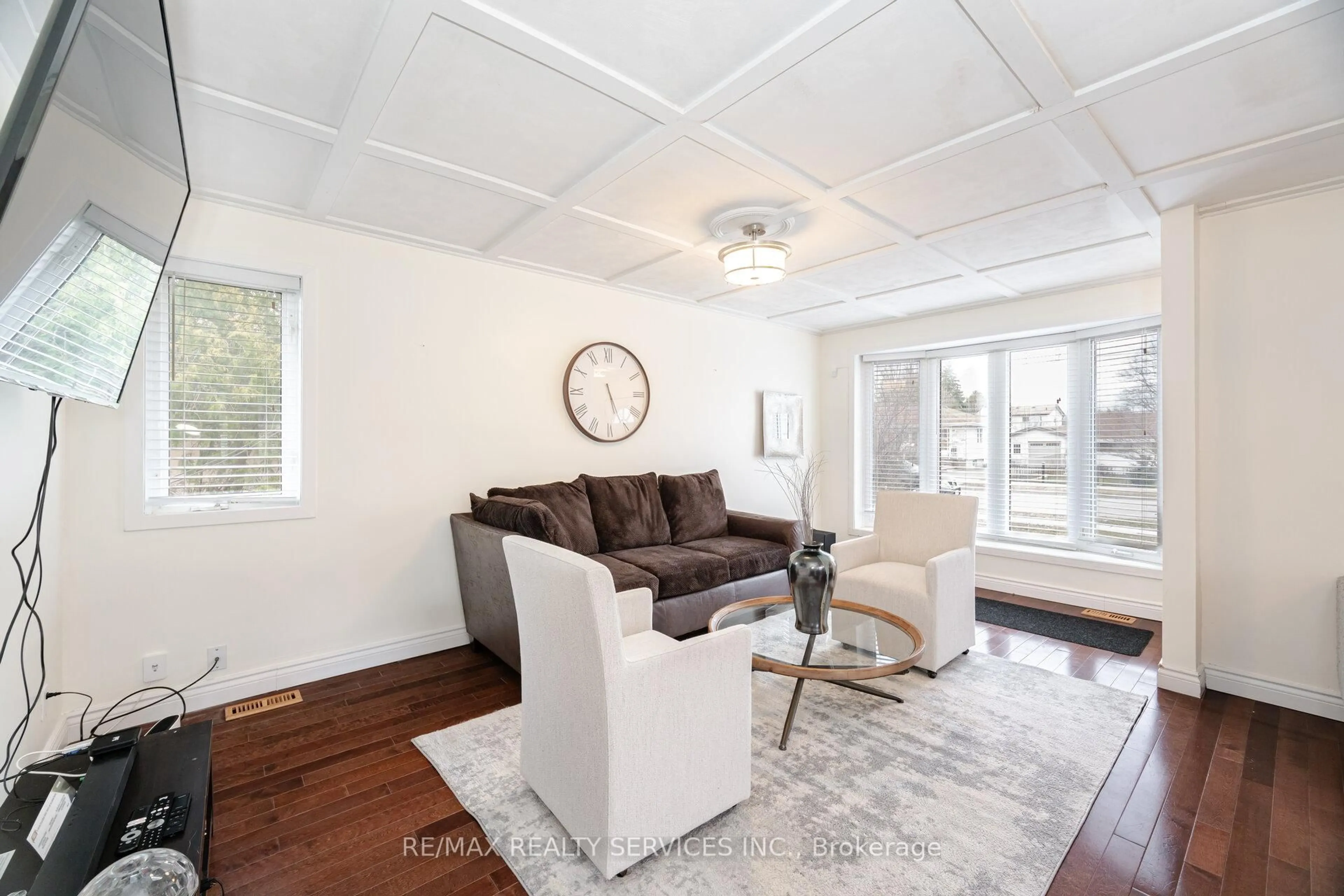 Living room with furniture, wood/laminate floor for 204 Craydon Rd, Whitby Ontario L1N 2B6