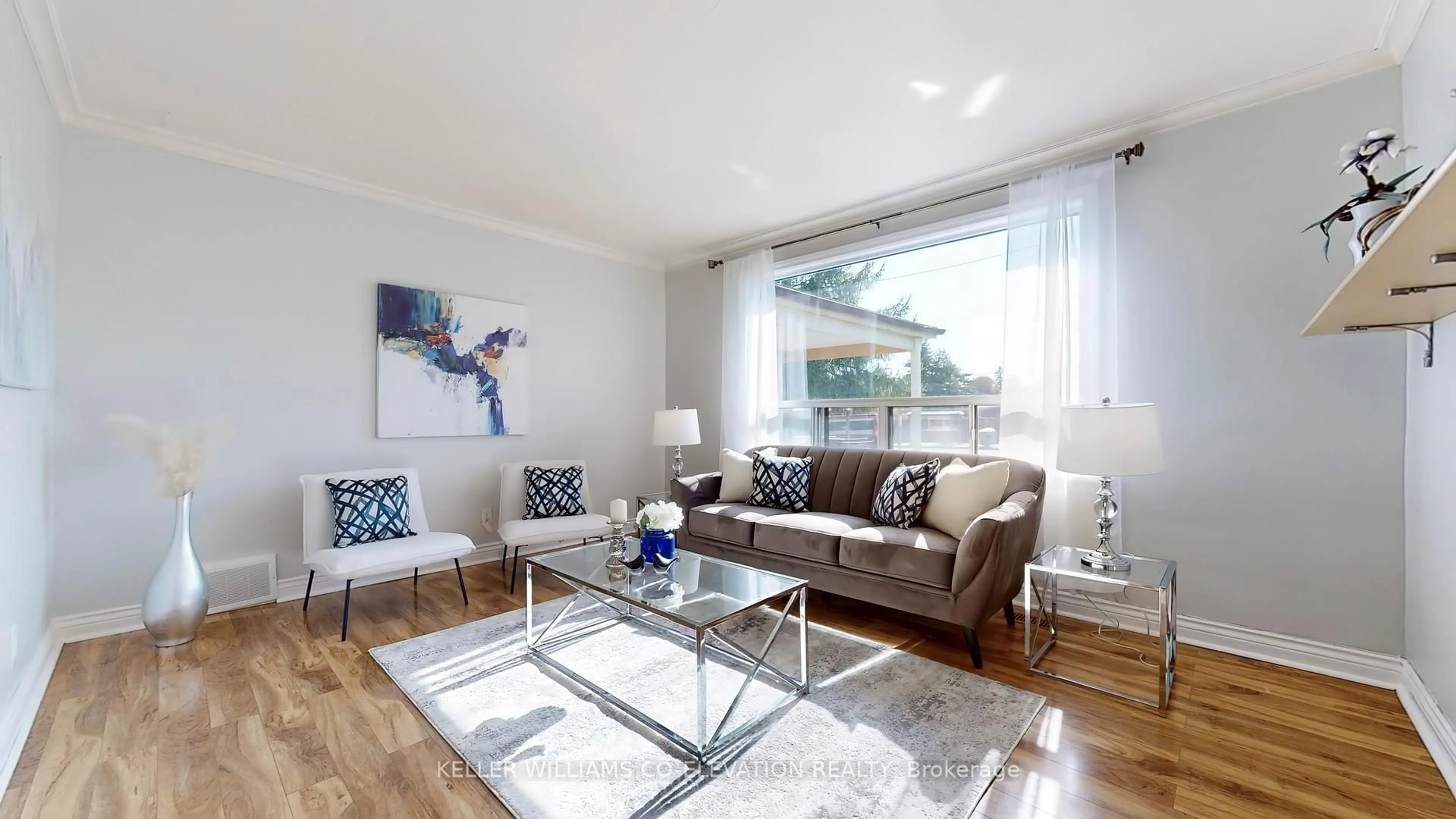 Living room with furniture, wood/laminate floor for 1465 Danforth Rd, Toronto Ontario M1J 1H4