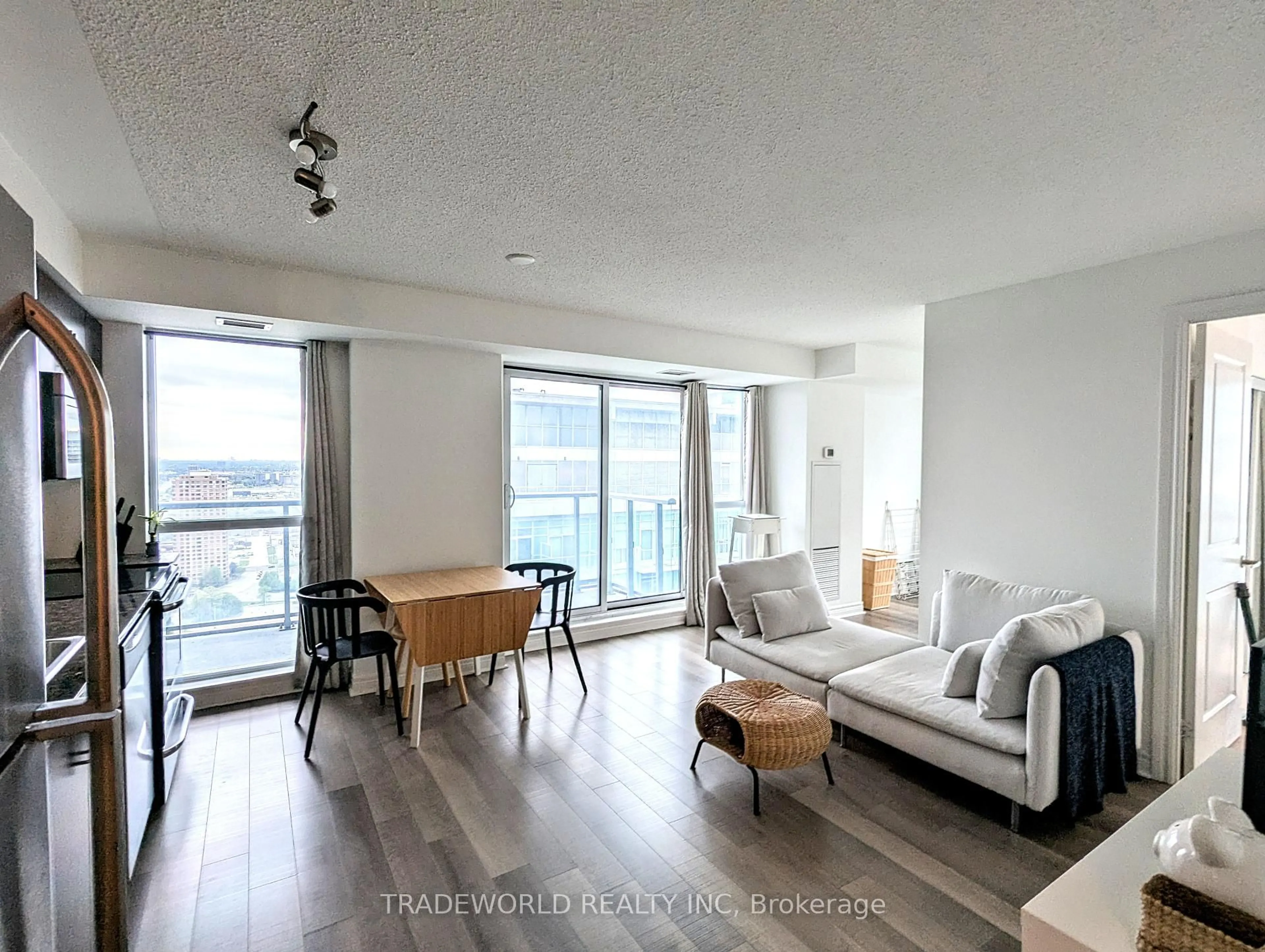 Living room with furniture, wood/laminate floor for 50 Town Centre Crt #3304, Toronto Ontario M1P 0A9