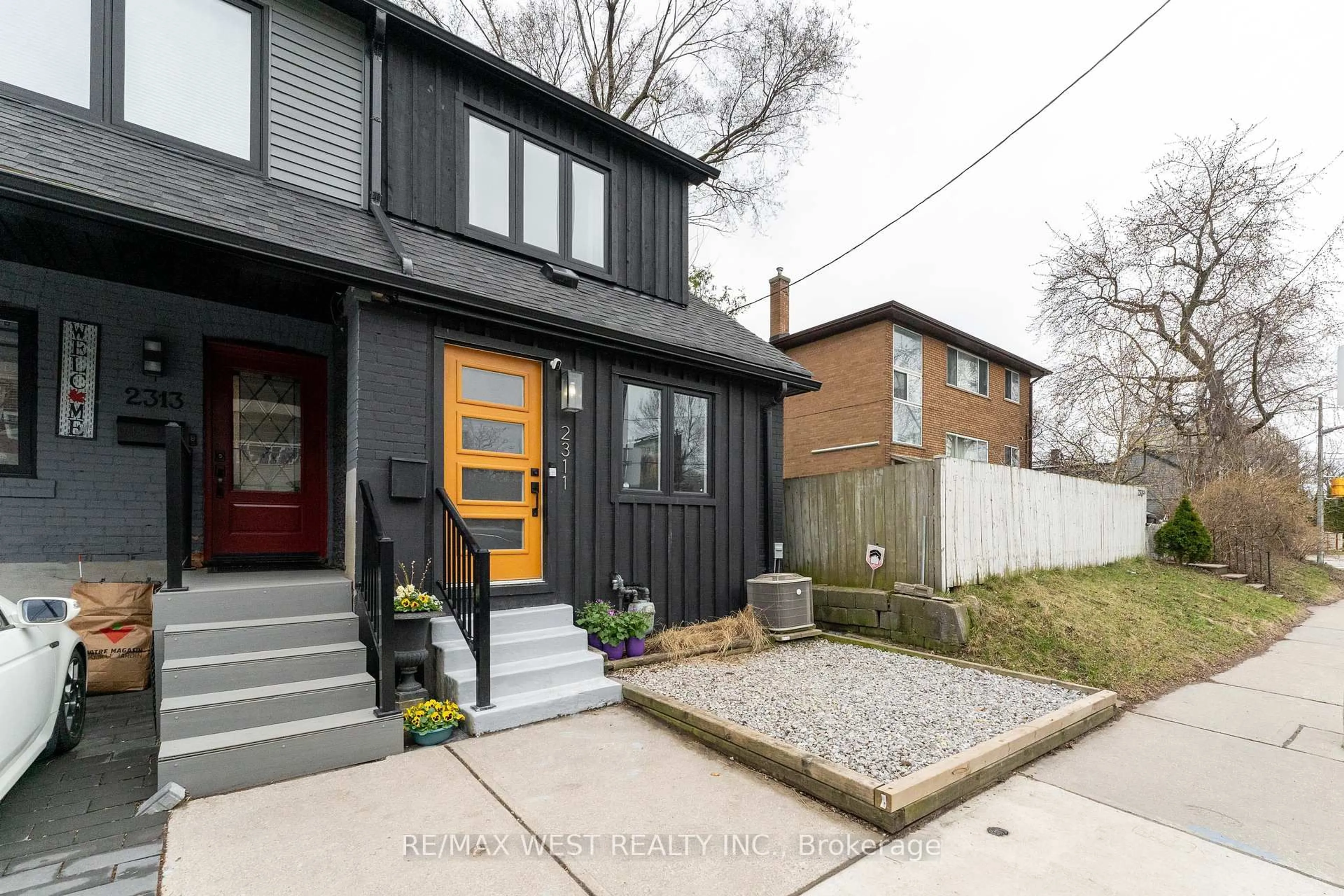 Home with brick exterior material, street for 2311 Gerrard St, Toronto Ontario M4E 2E5