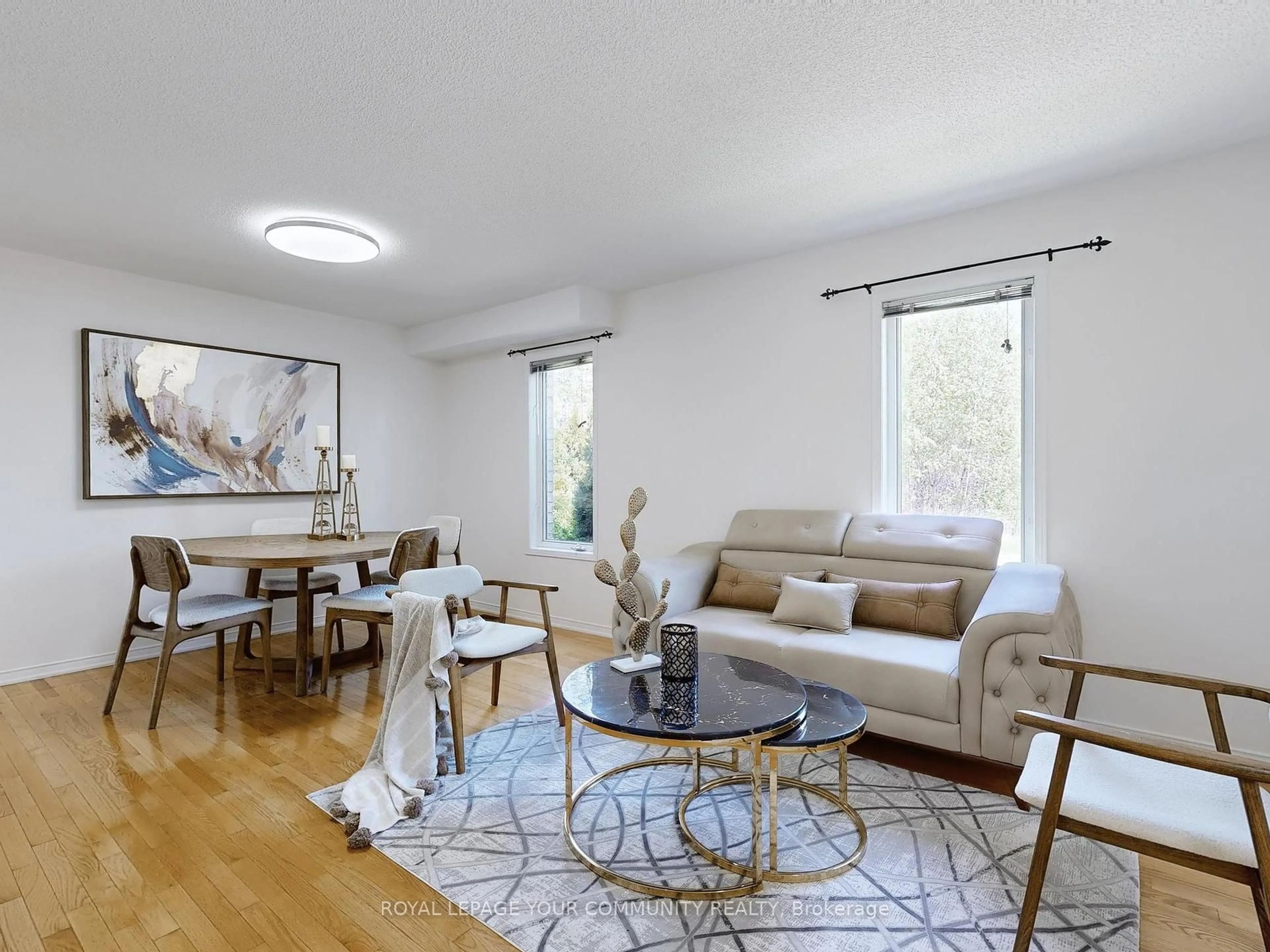 Living room with furniture, wood/laminate floor for 20 May Apple Terr, Toronto Ontario M1E 5J8