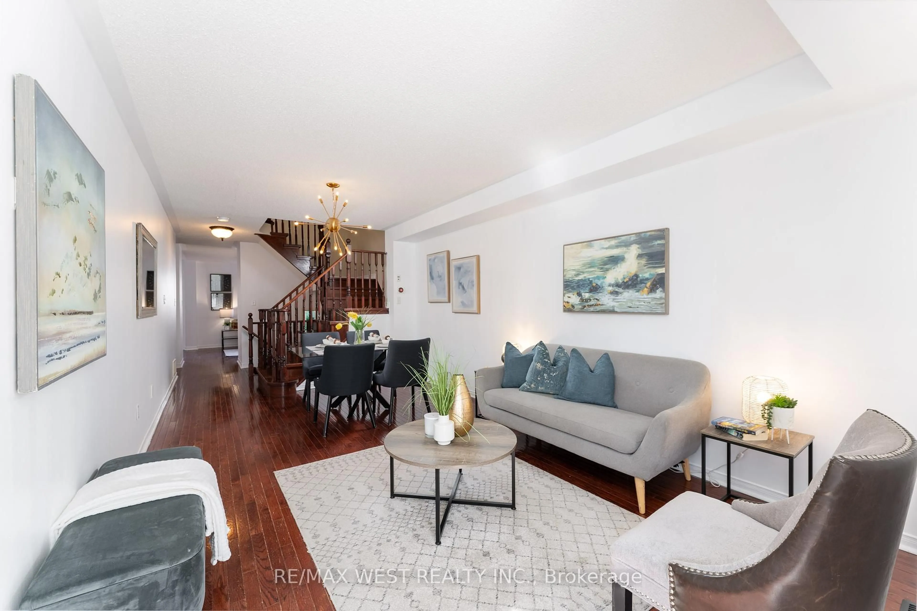 Living room with furniture, wood/laminate floor for 101 Vessel Cres, Toronto Ontario M1C 5K5