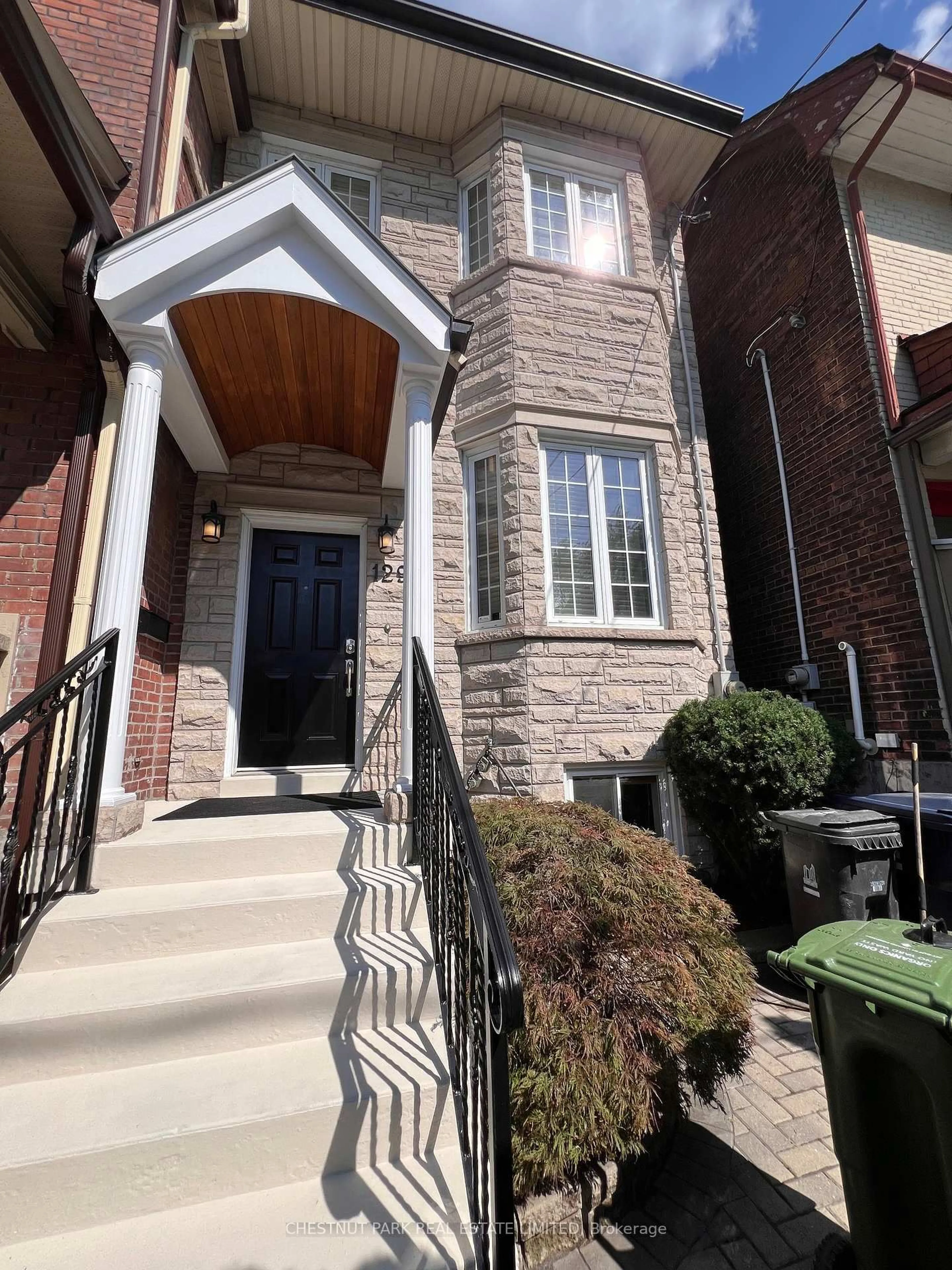 Home with brick exterior material, street for 129 Jones Ave, Toronto Ontario M4M 2Z7