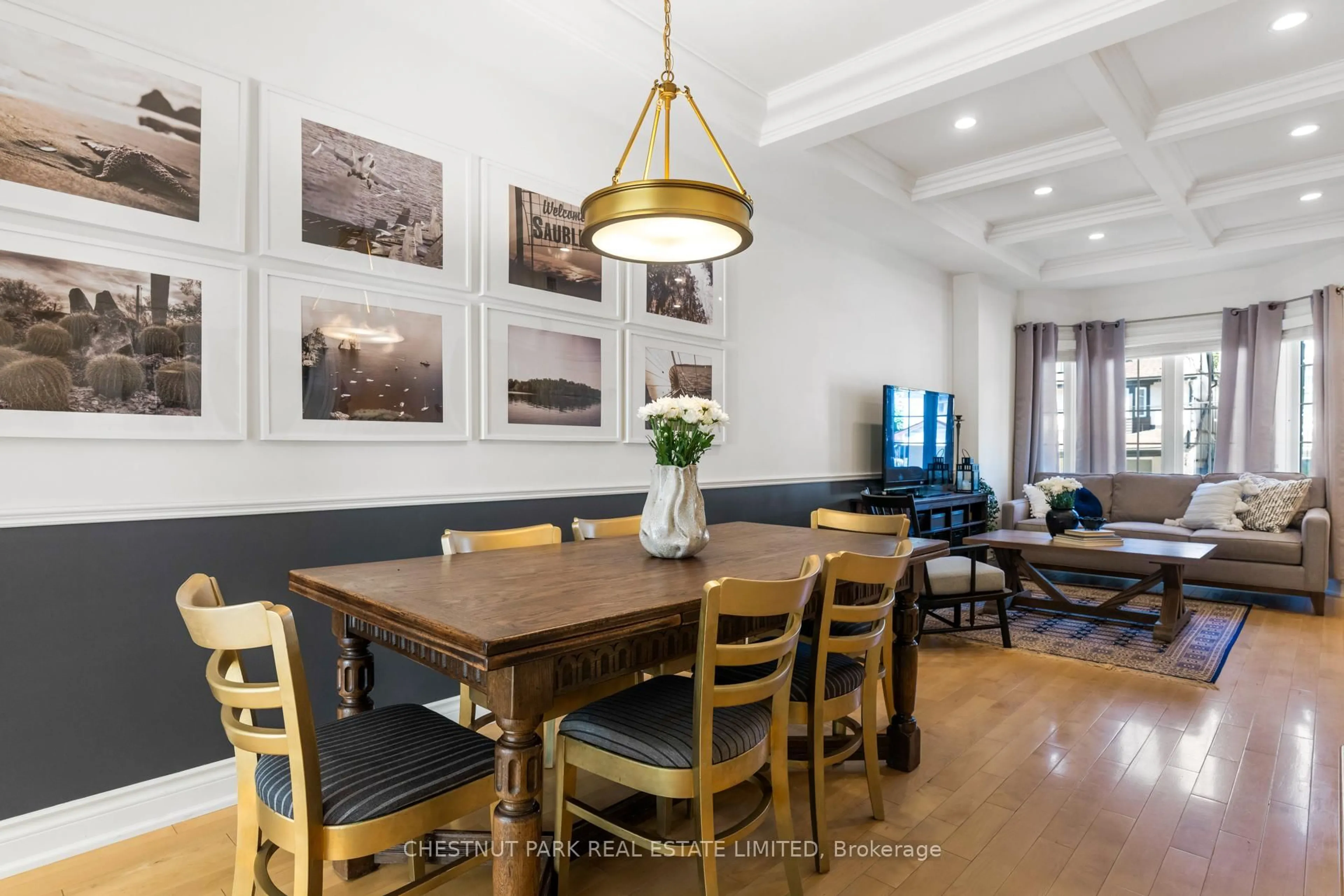 Dining room, wood/laminate floor for 129 Jones Ave, Toronto Ontario M4M 2Z7