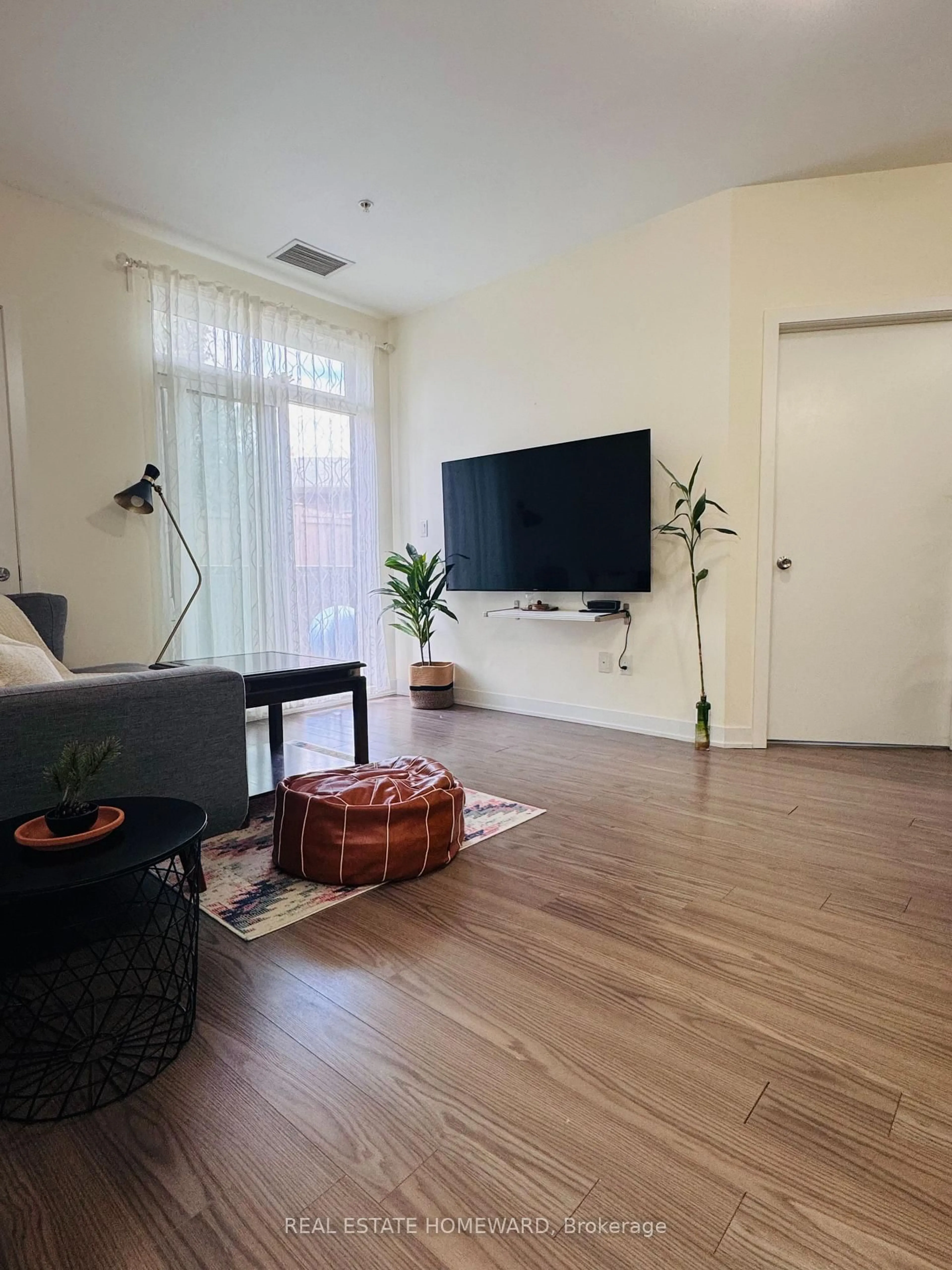 Living room with furniture, unknown for 3560 St Clair Ave Ave #106, Toronto Ontario M1K 0A9