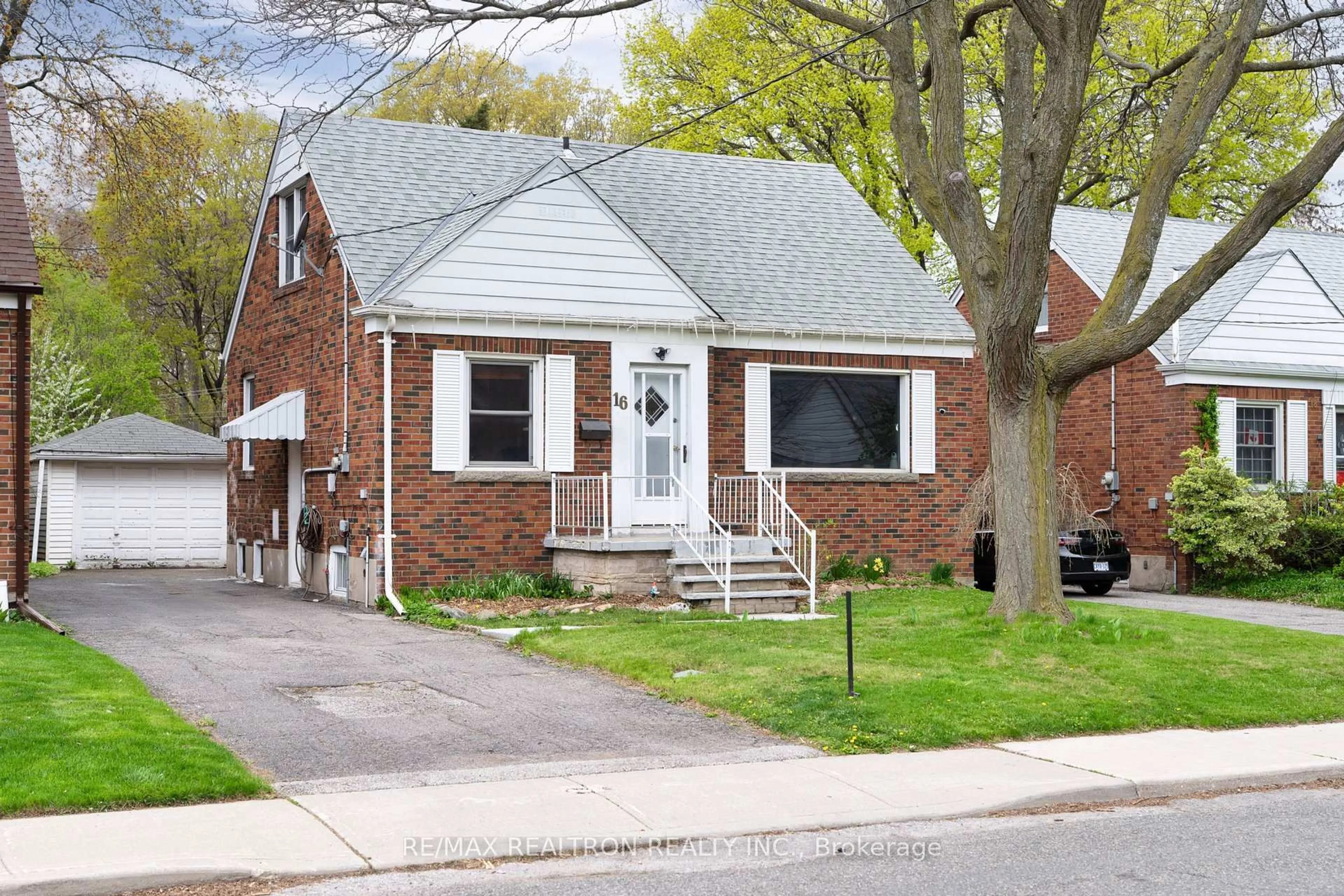 Home with brick exterior material, street for 16 Plaxton Dr, Toronto Ontario M4B 2P8