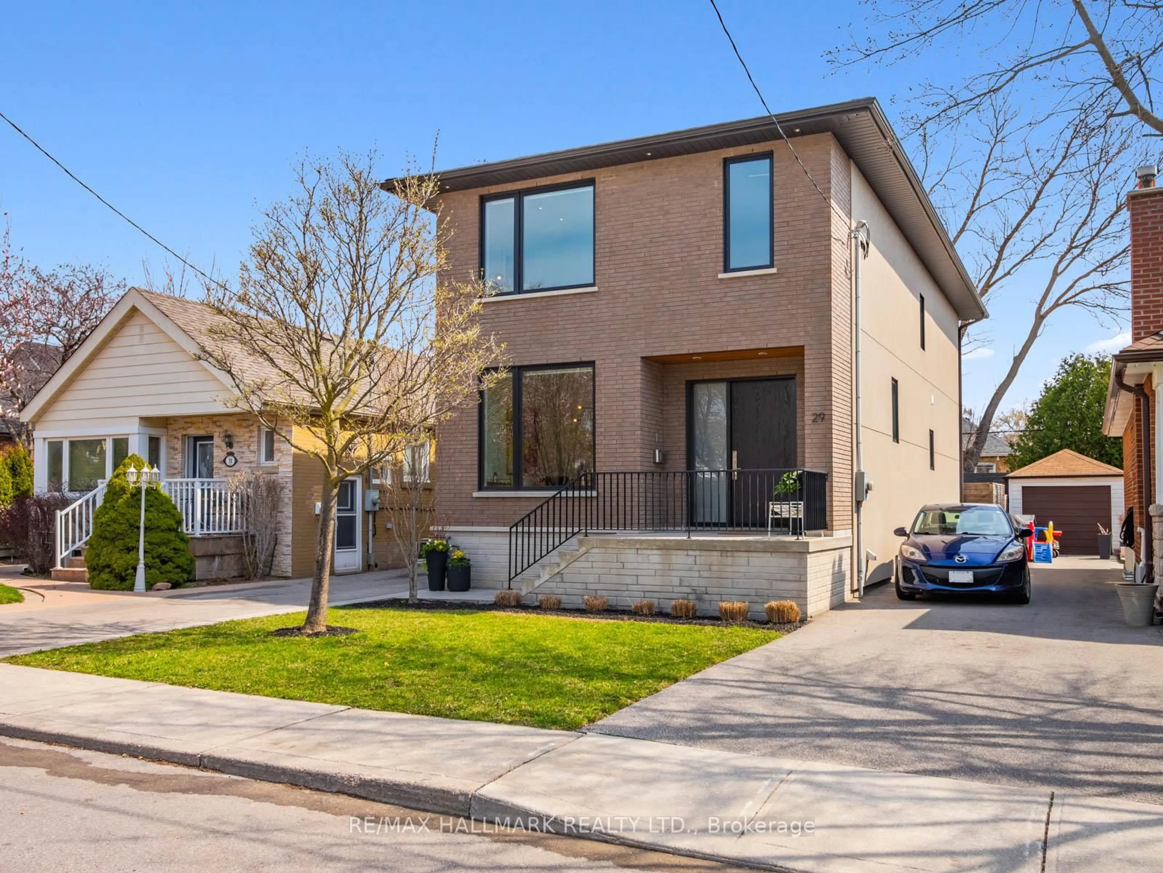 Home with brick exterior material, street for 29 Treadway Blvd, Toronto Ontario M4C 3H6
