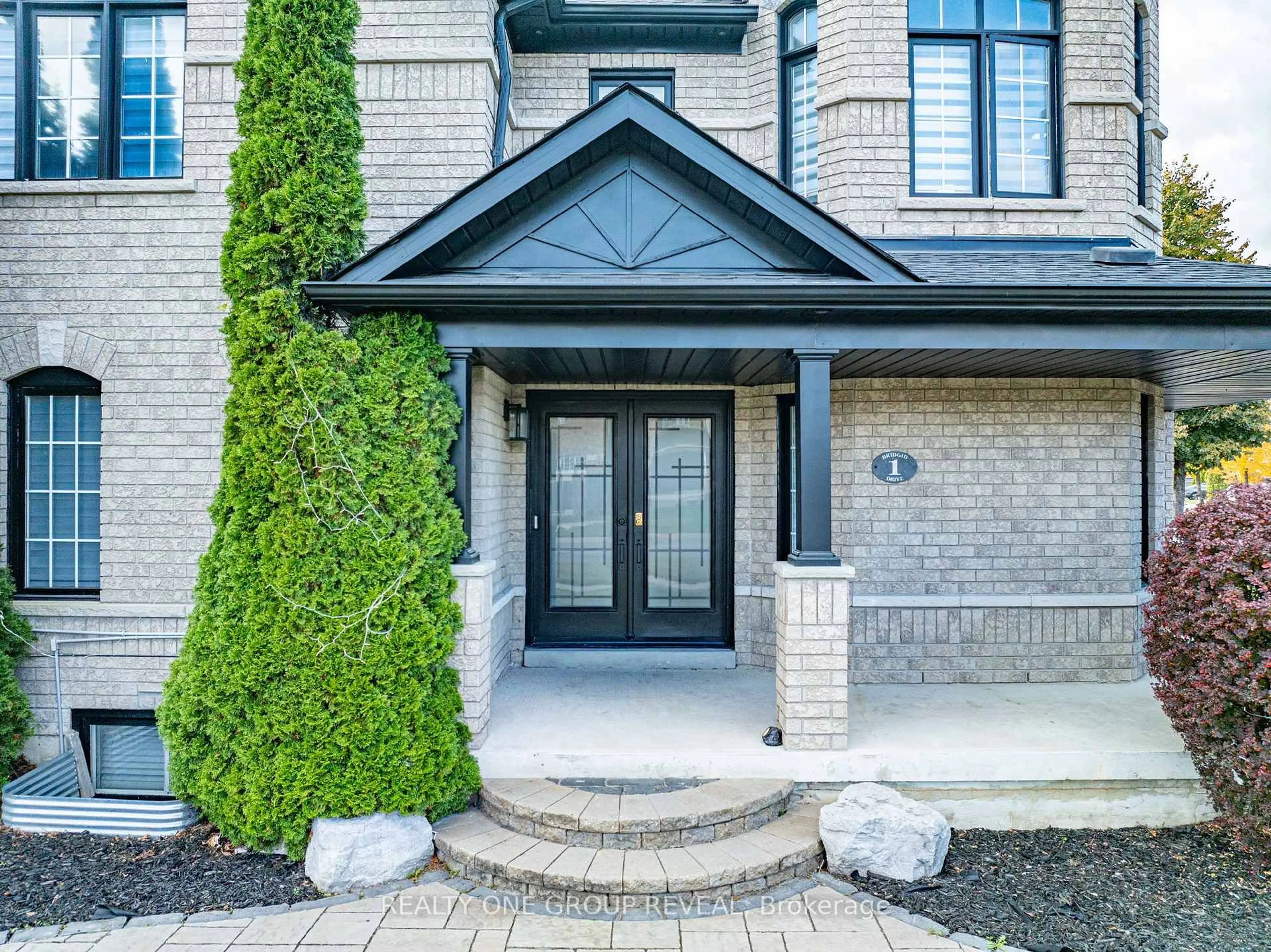 Home with brick exterior material, street for 1 Bridgid Dr, Whitby Ontario L1P 1T7