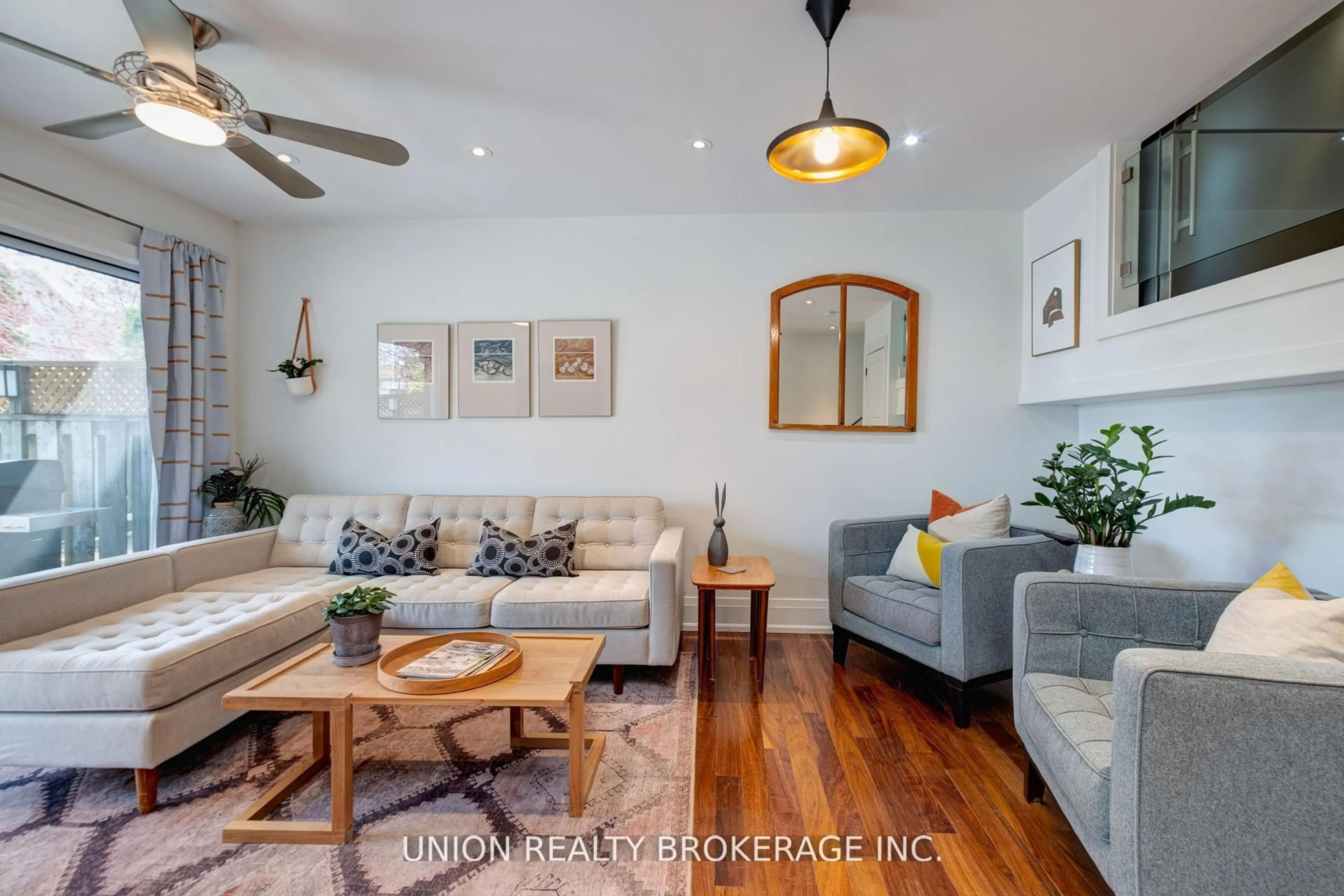 Living room with furniture, wood/laminate floor for 50 Battenberg Ave #4, Toronto Ontario M4L 1J8