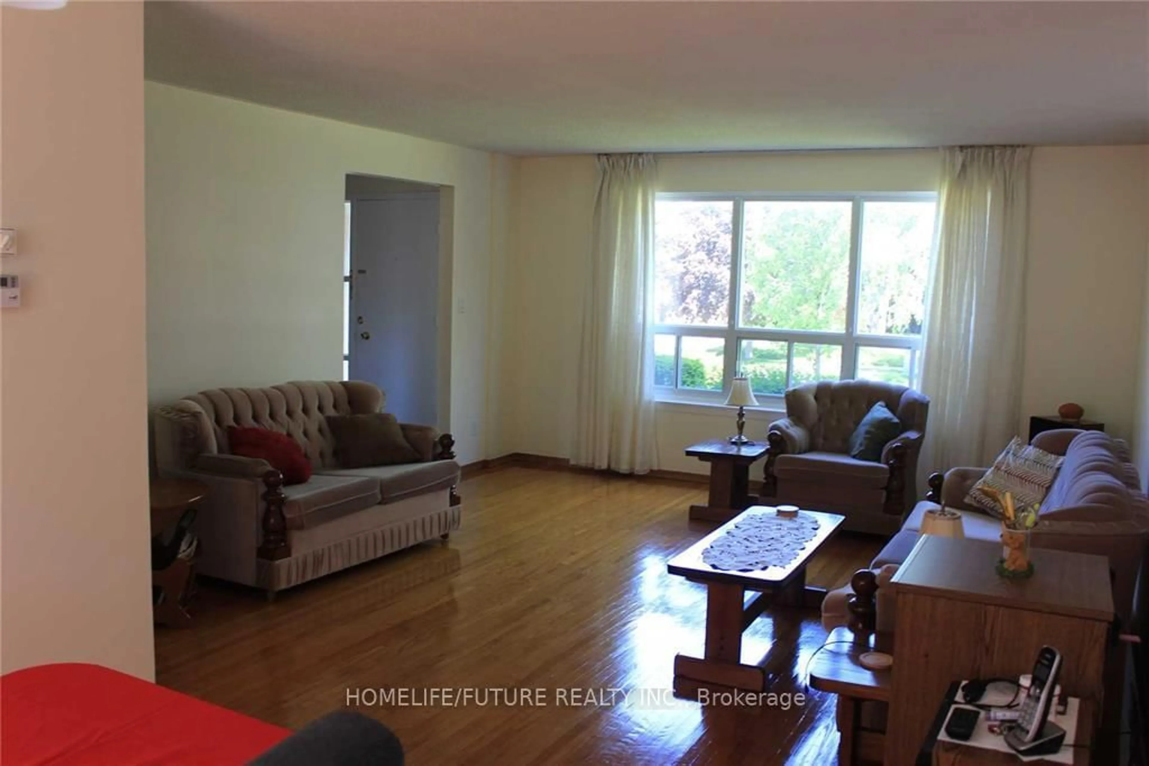 Living room with furniture, wood/laminate floor for 49 Kentish Cres, Toronto Ontario M1S 2Z3