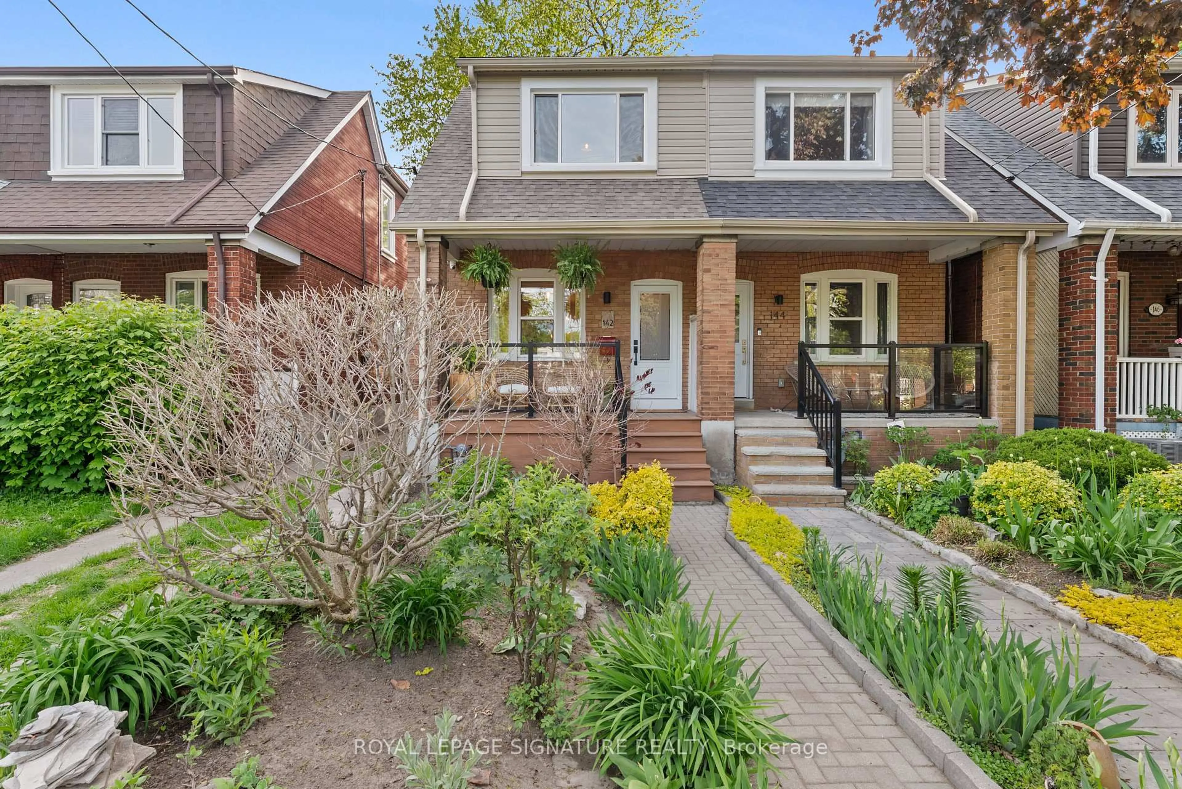 Home with brick exterior material, street for 142 Dewhurst Blvd, Toronto Ontario M4J 3J9