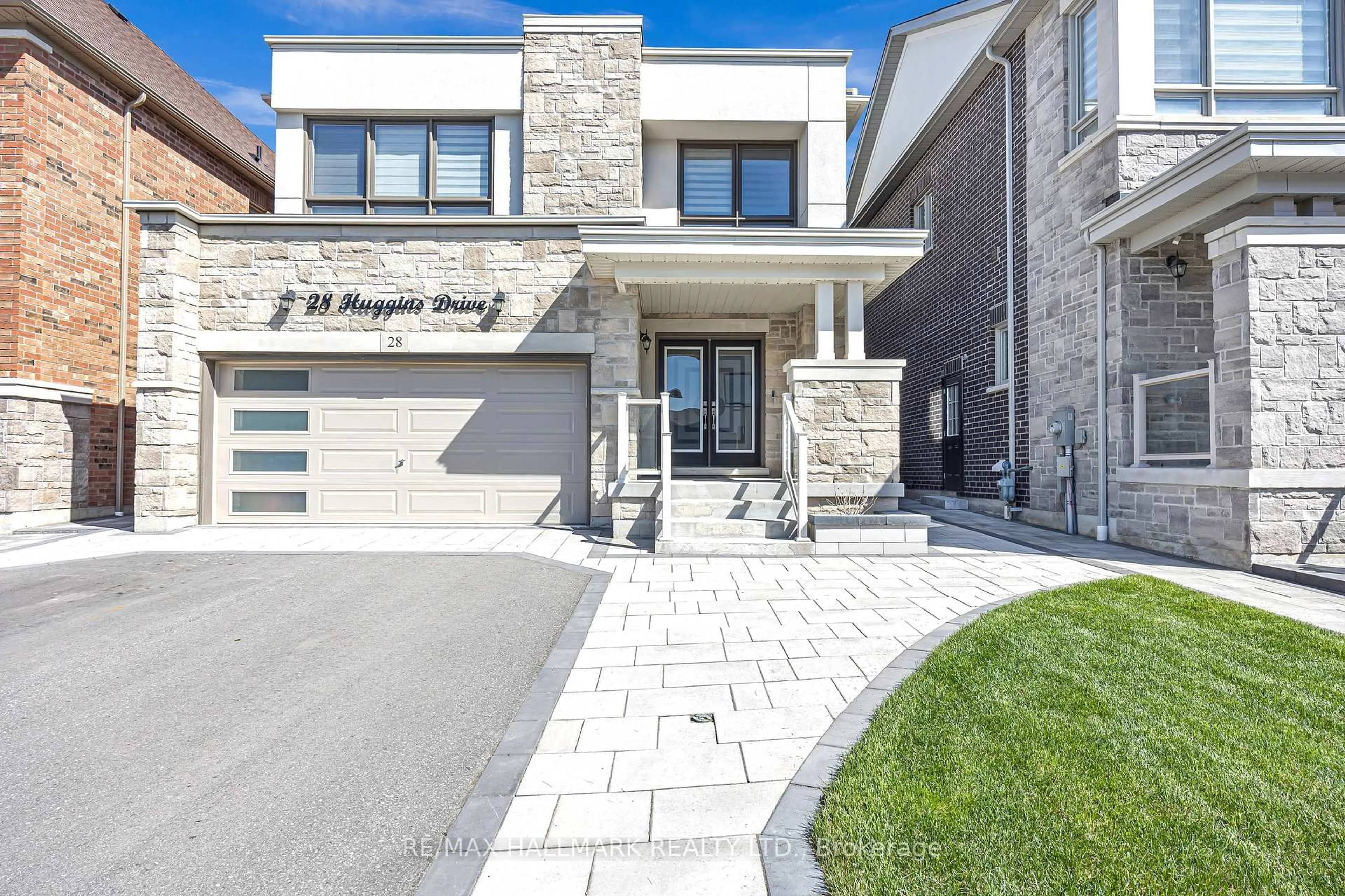 Home with brick exterior material, street for 28 Huggins Dr, Whitby Ontario L1P 0N4