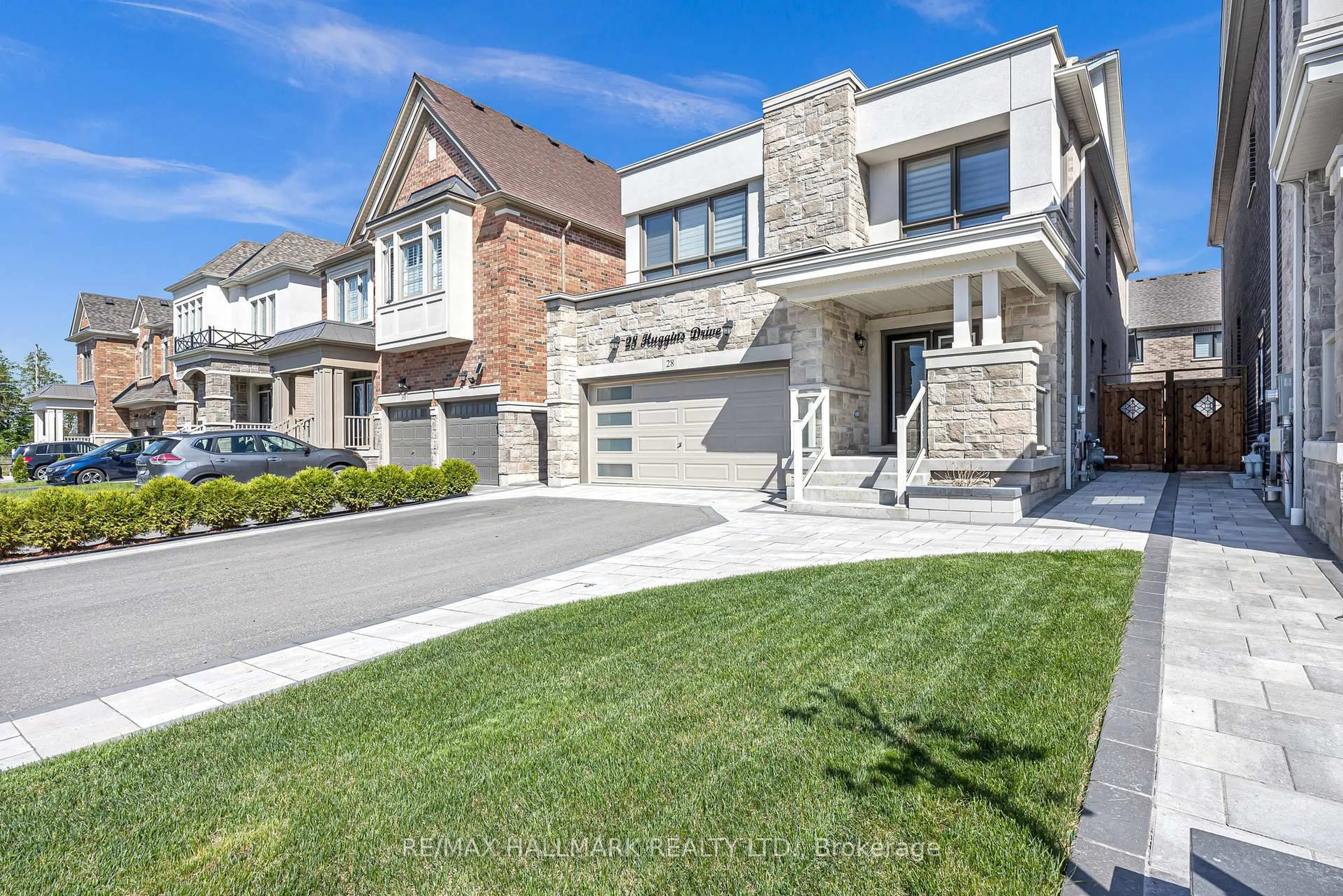 Home with brick exterior material, street for 28 Huggins Dr, Whitby Ontario L1P 0N4