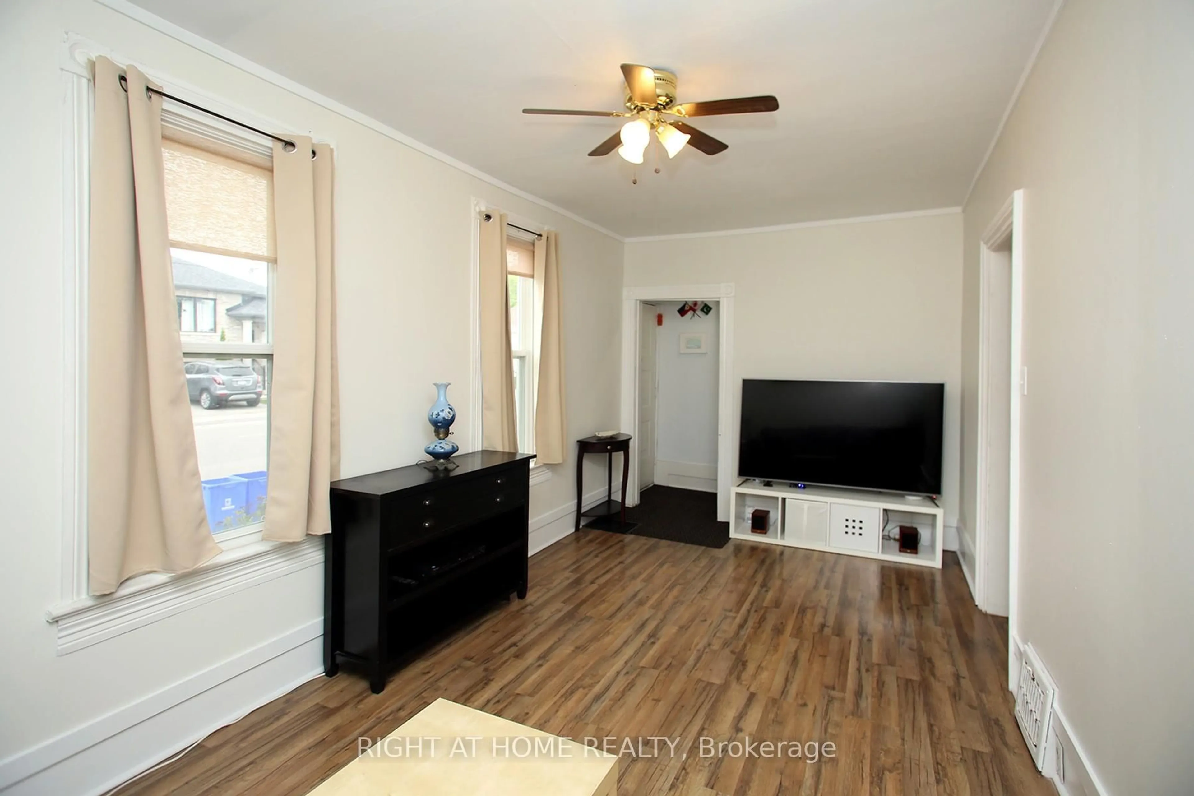 Living room with furniture, wood/laminate floor for 217 Celina St, Oshawa Ontario L1H 4N7