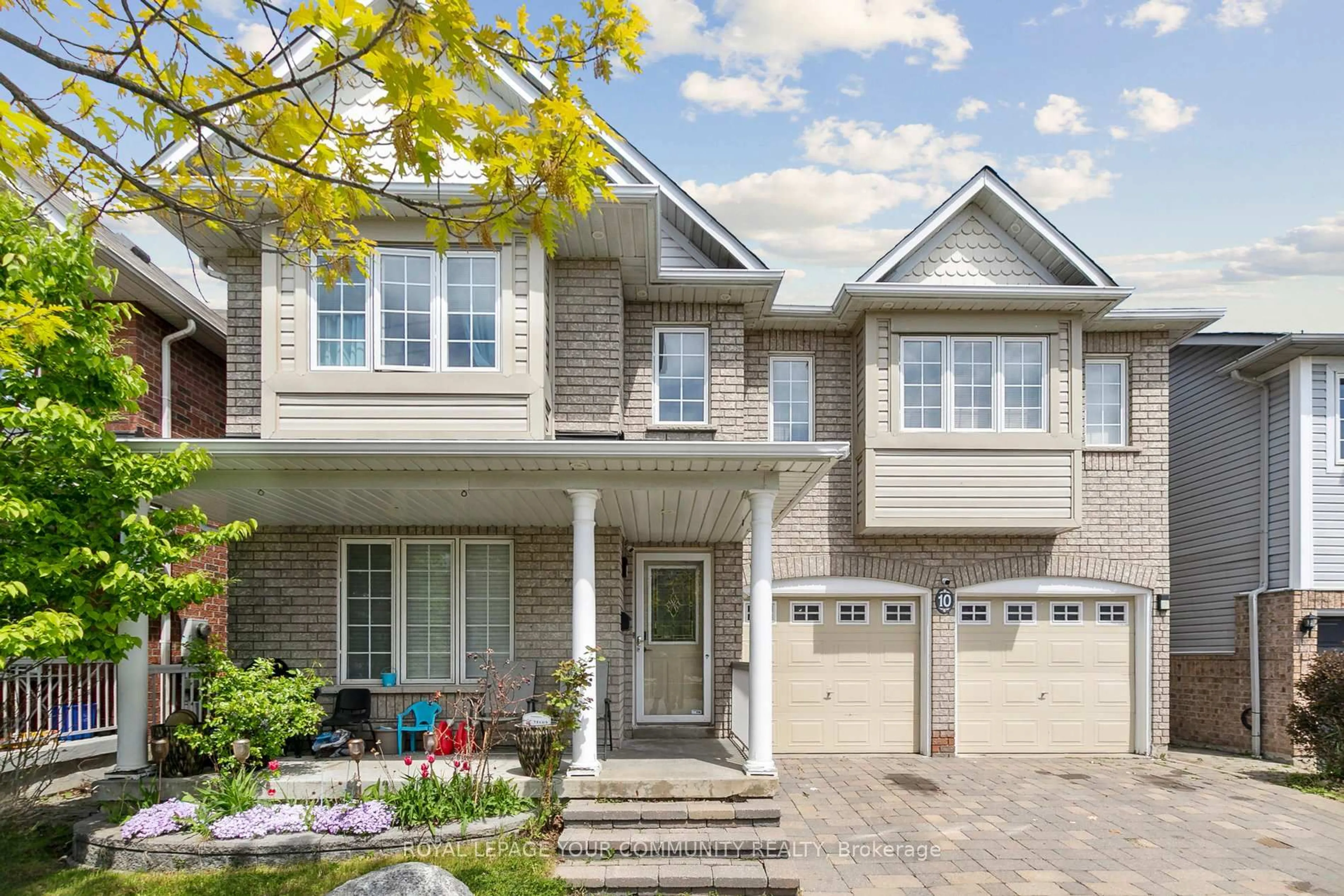 Home with brick exterior material, street for 10 Greenhalf Dr, Ajax Ontario L1S 7N6