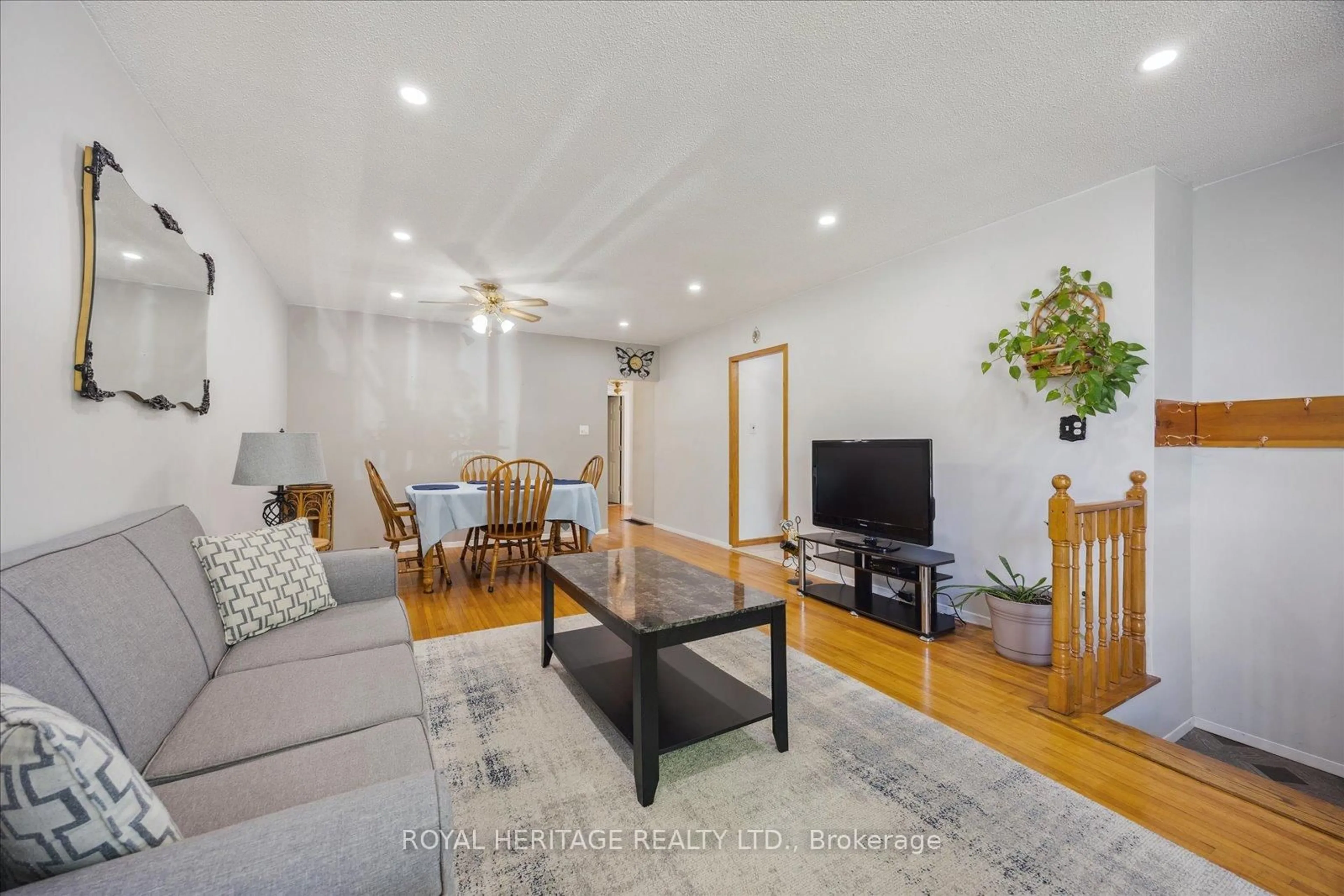 Living room with furniture, wood/laminate floor for 304 Rosedale Dr, Whitby Ontario L1N 1Z3