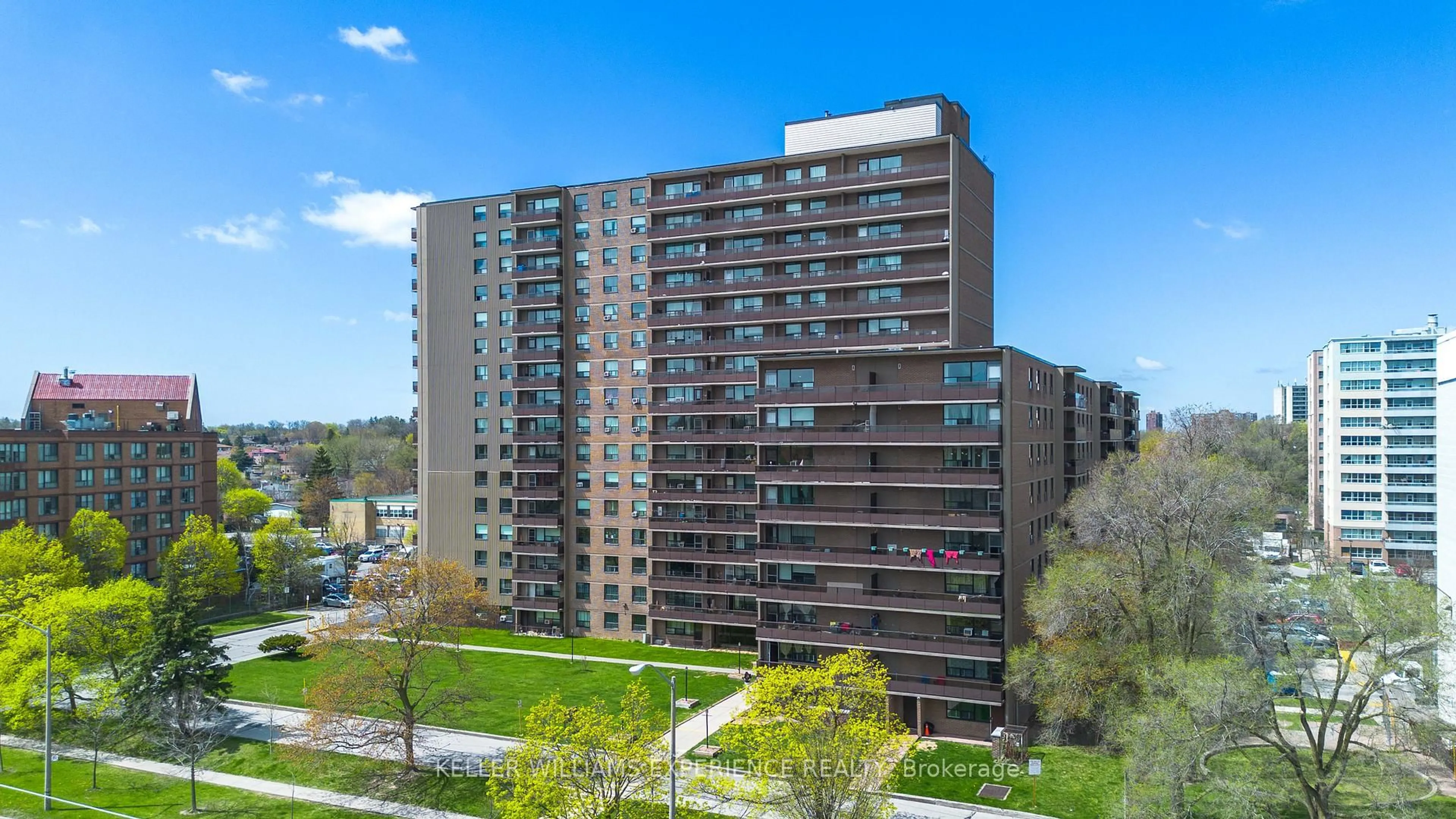 A pic from outside/outdoor area/front of a property/back of a property/a pic from drone, city buildings view from balcony for 180 Markham Rd #117, Toronto Ontario M1M 2Z9