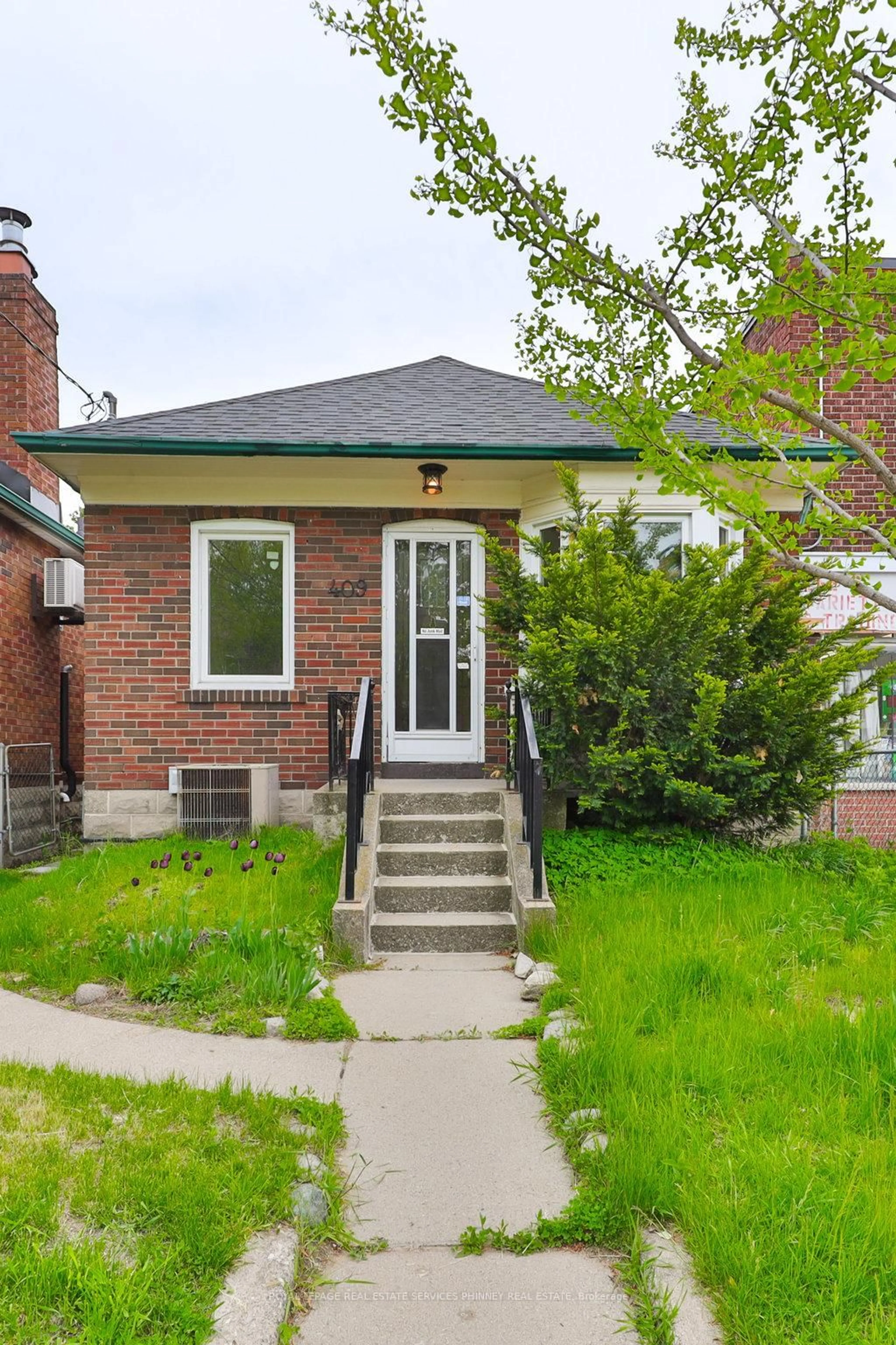 Home with brick exterior material, street for 409 Mortimer Ave, Toronto Ontario M4J 2E8