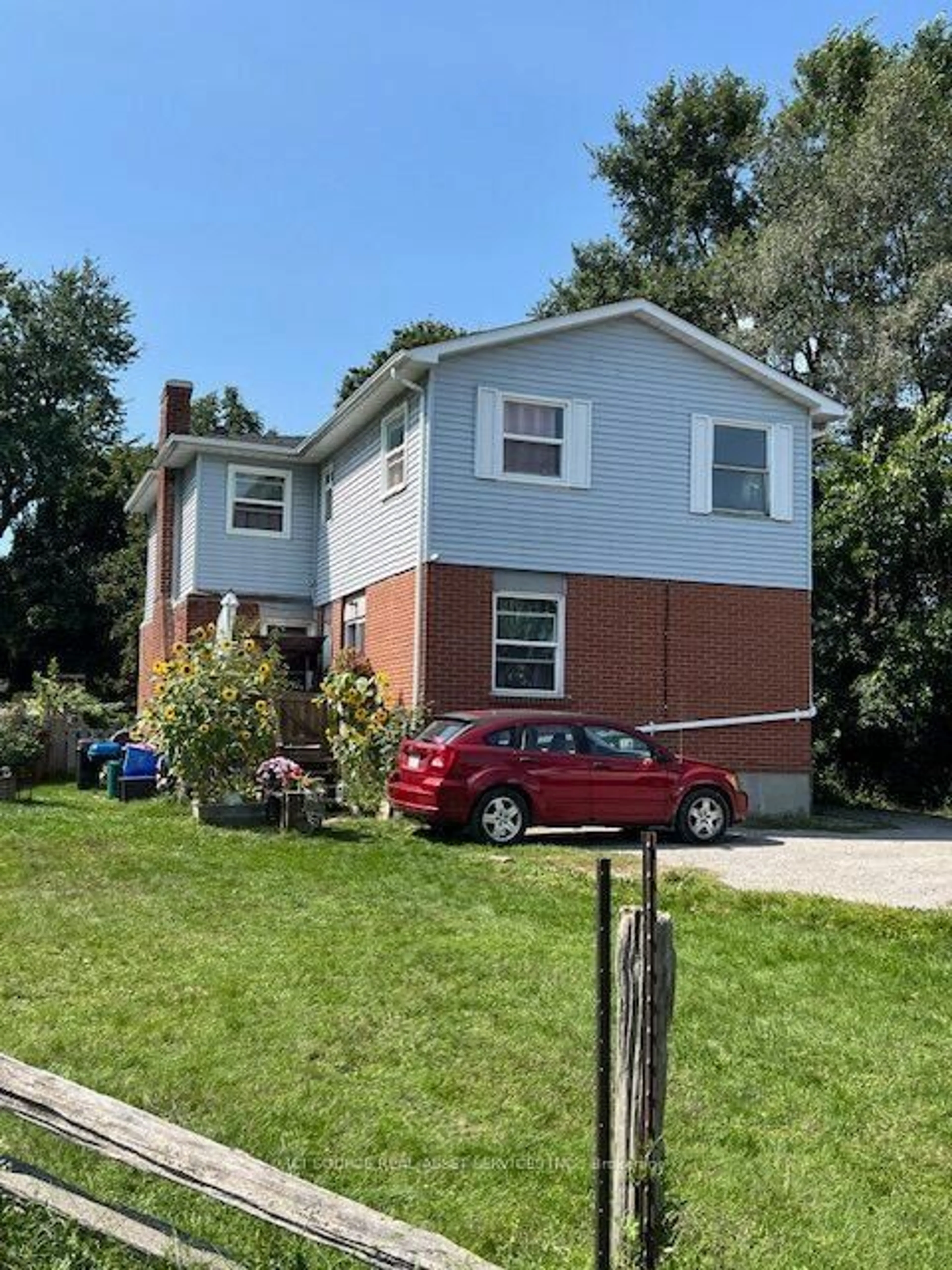 Home with vinyl exterior material, street for 1100 Simcoe St, Oshawa Ontario L1H 4L6