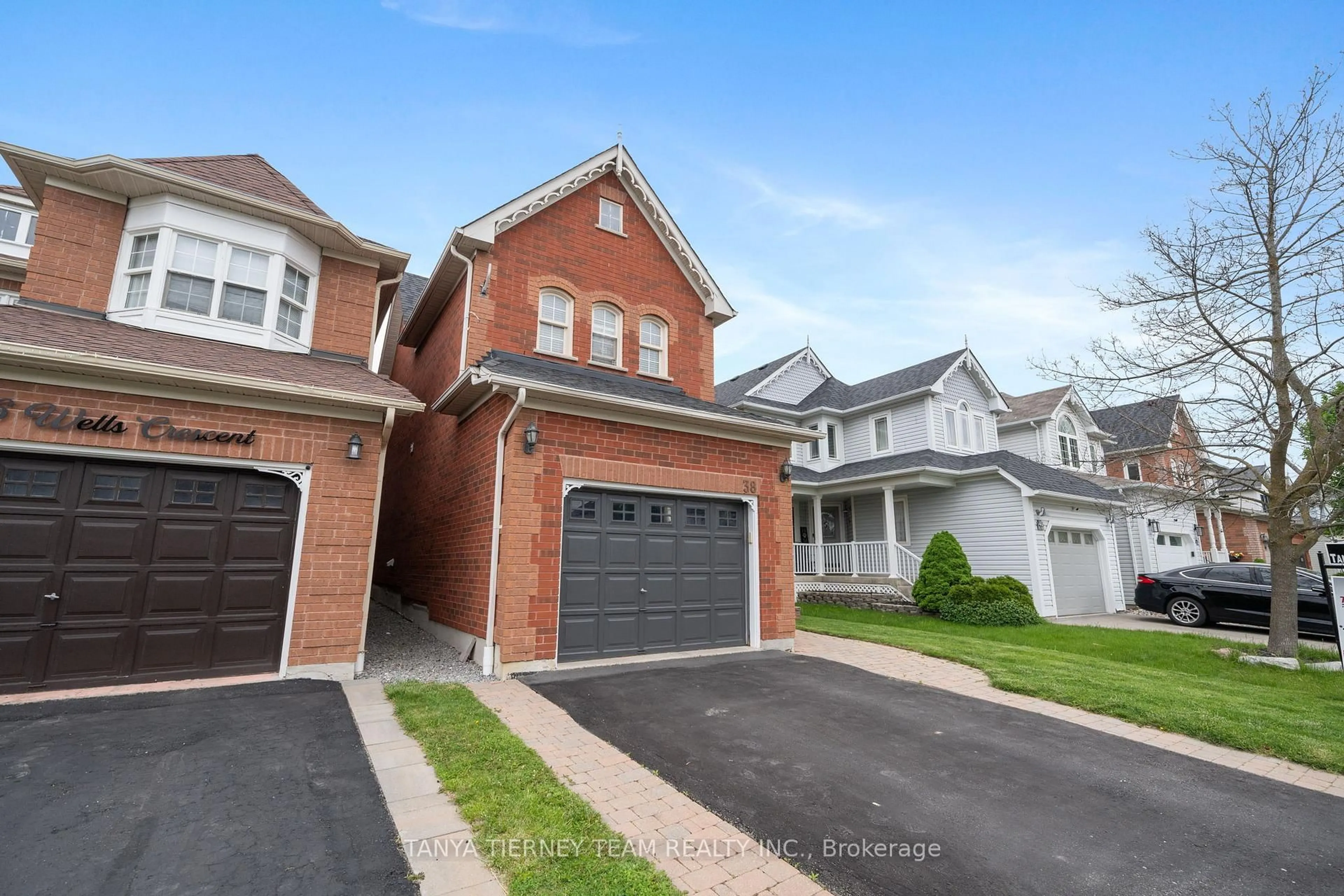 Home with brick exterior material, street for 38 Wells Cres, Whitby Ontario L1M 1C9