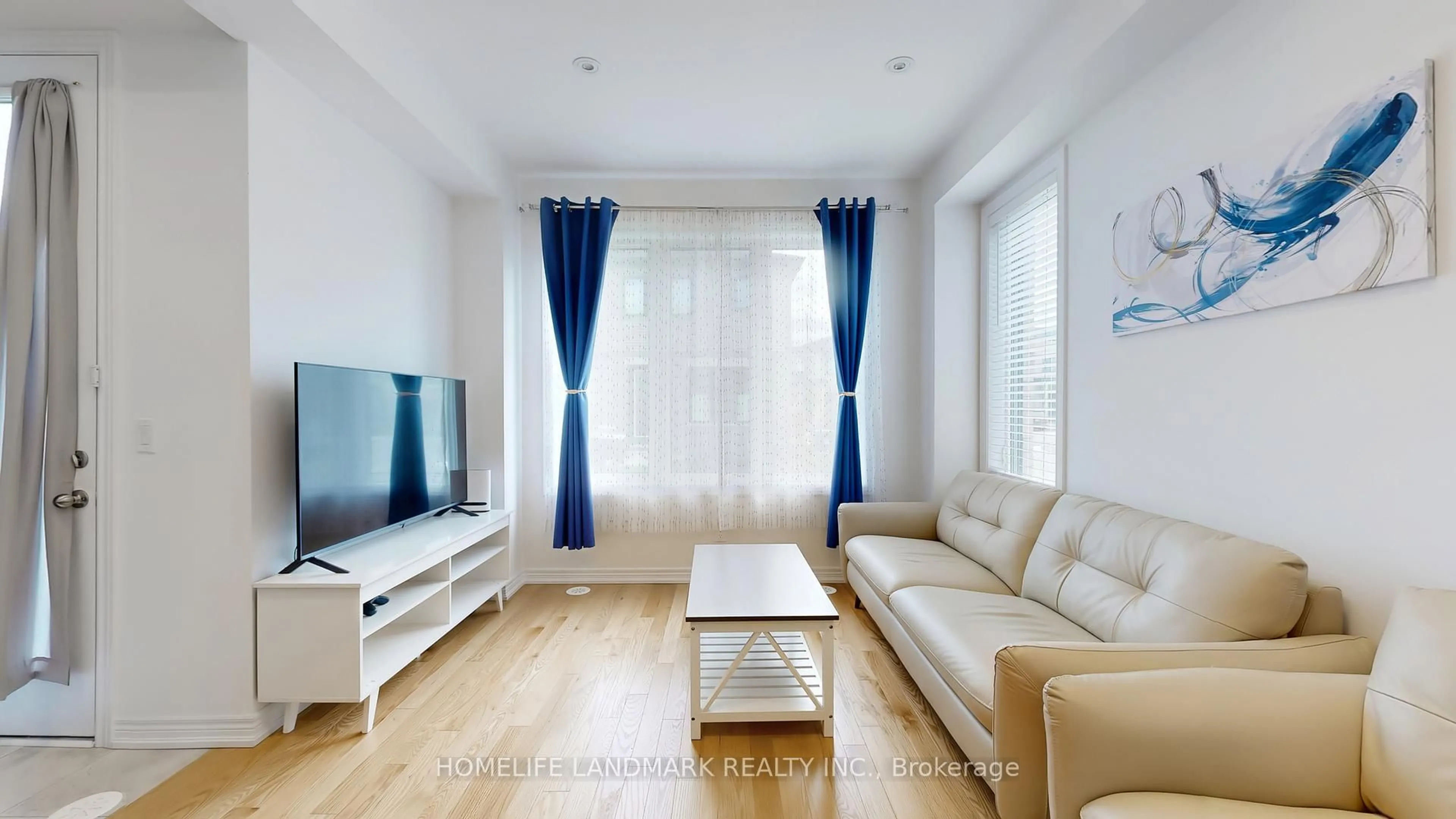 Living room with furniture, wood/laminate floor for 62 Sorbara Way, Whitby Ontario L1M 0M4