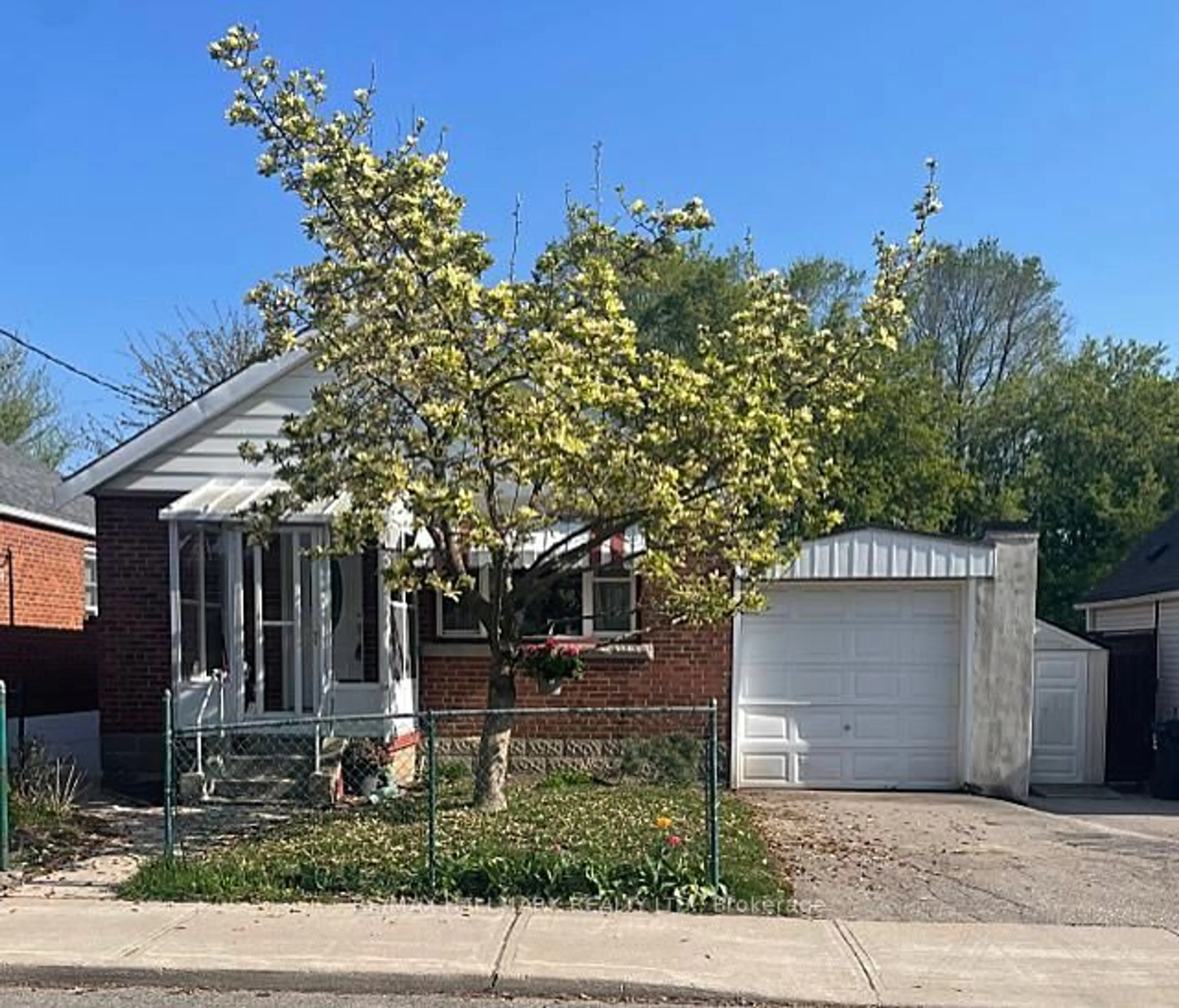 Home with brick exterior material, street for 27 Adair Rd, Toronto Ontario M4B 1V4