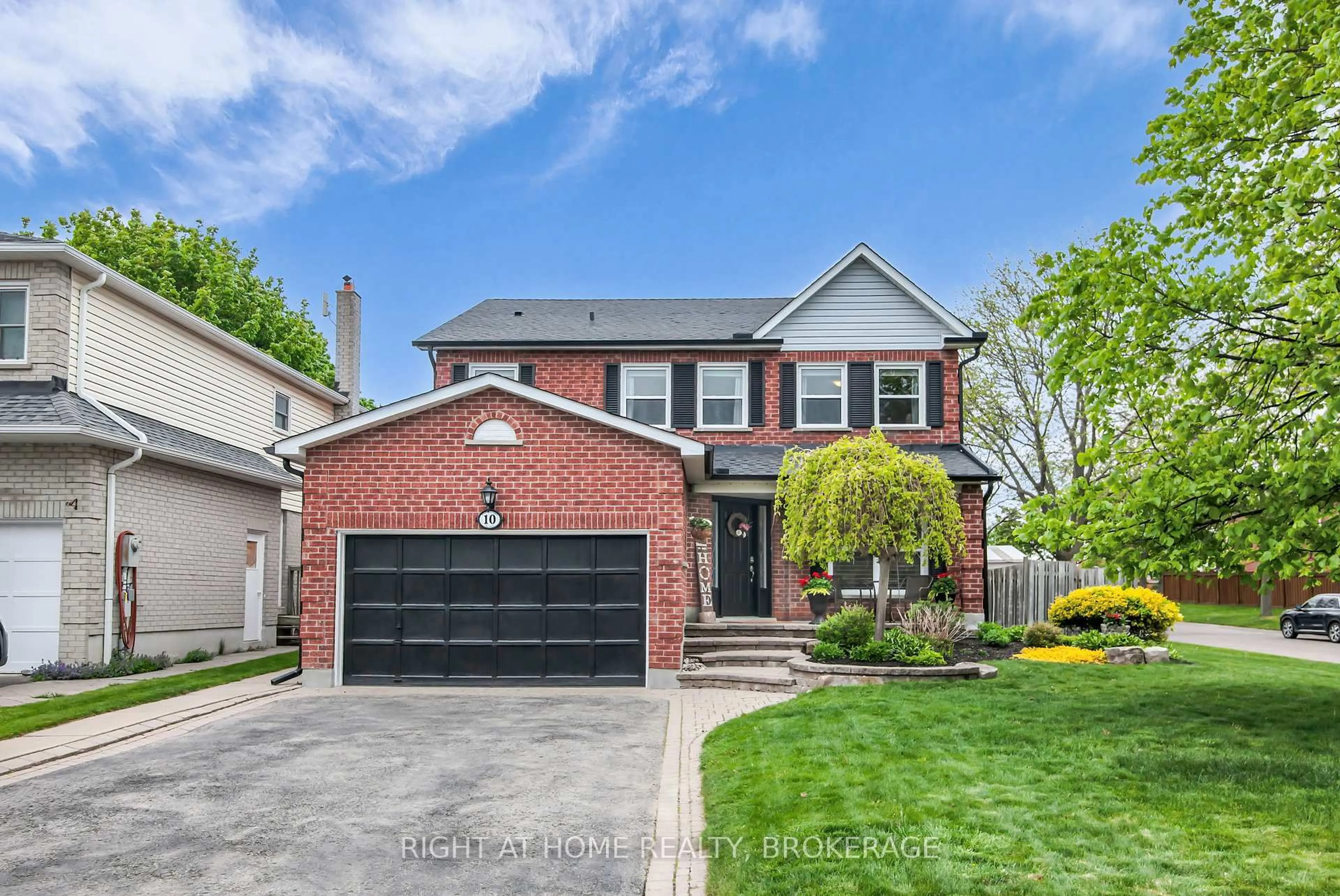 Home with brick exterior material, street for 10 Ennisclare Pl, Whitby Ontario L1R 1R9