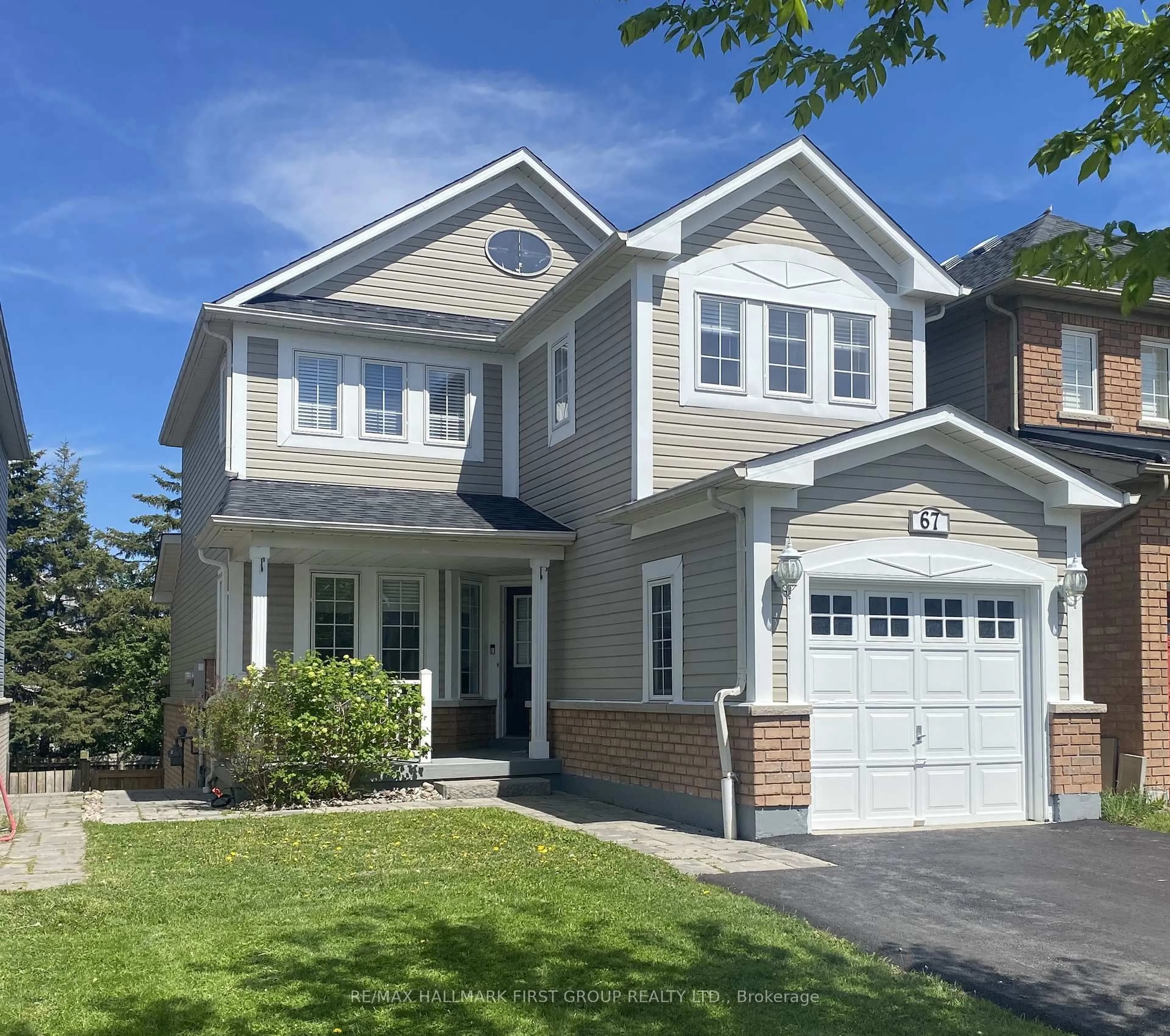 Home with vinyl exterior material, street for 67 Tallships Dr, Whitby Ontario L1N 9X7