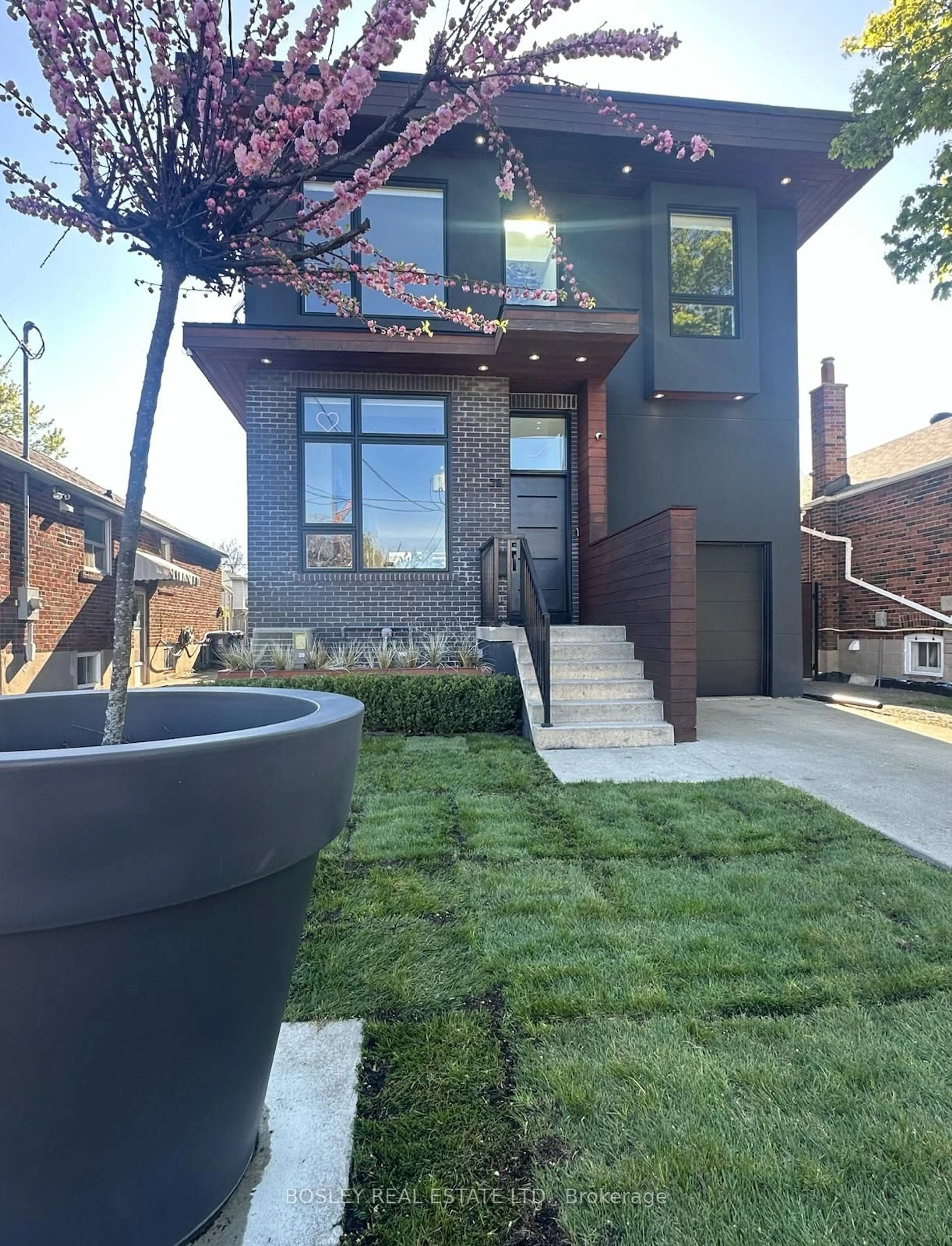 Home with brick exterior material, street for 38 Roblin Ave, Toronto Ontario M4C 3R1