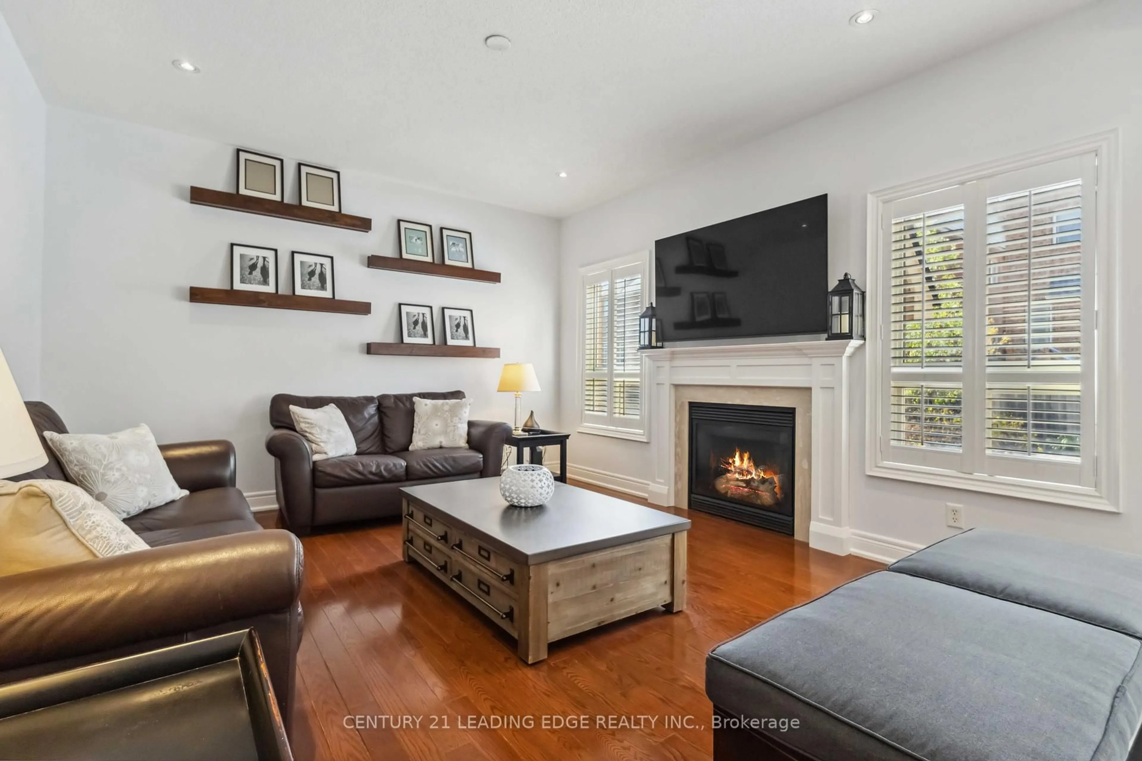 Living room with furniture, wood/laminate floor for 64 Williamson Dr, Ajax Ontario L1T 0A9